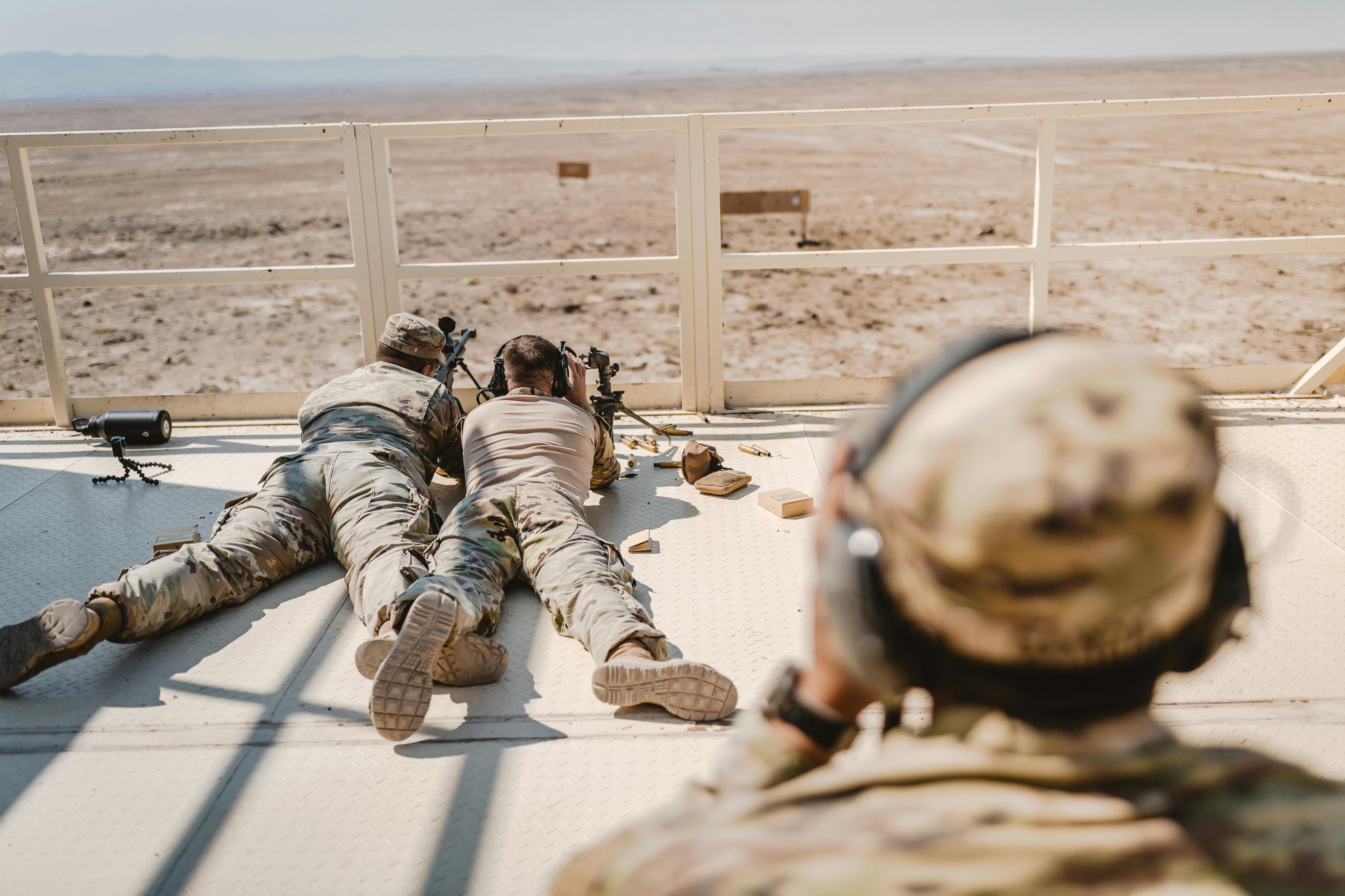 Snipers Lying on Front on Balcony