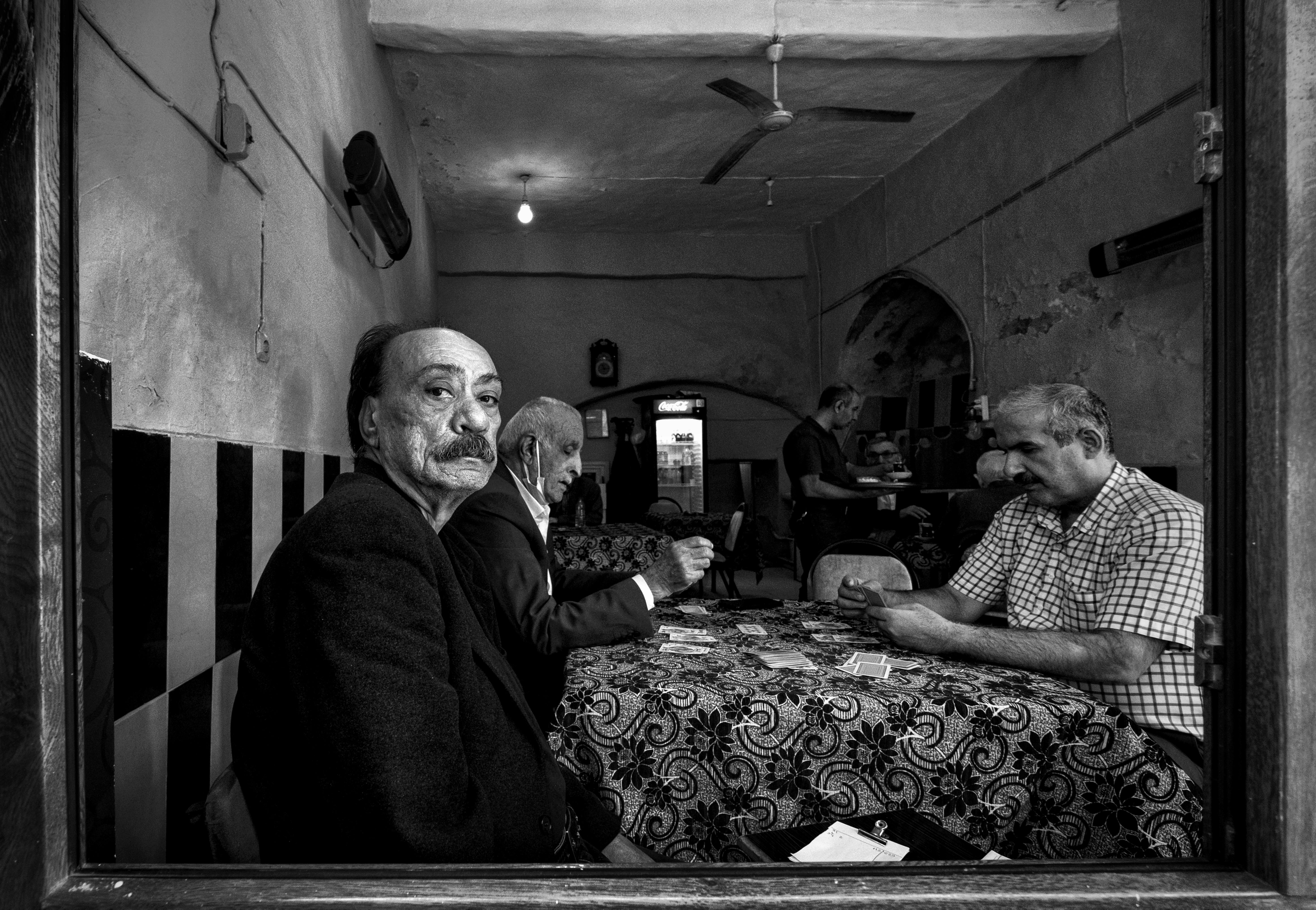 Men Playing Cards in a Restaurant