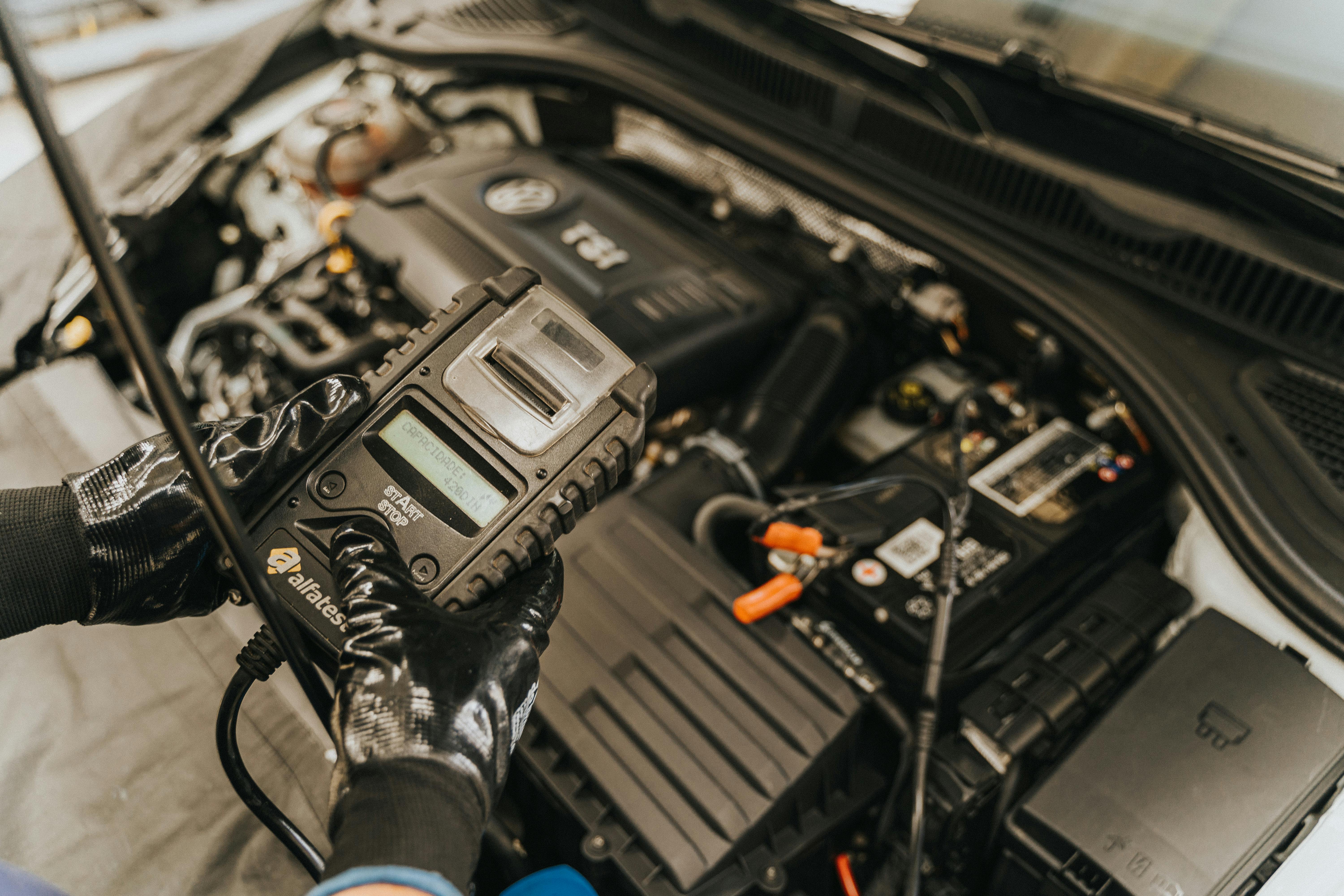 Mechanic Working with Car Engine