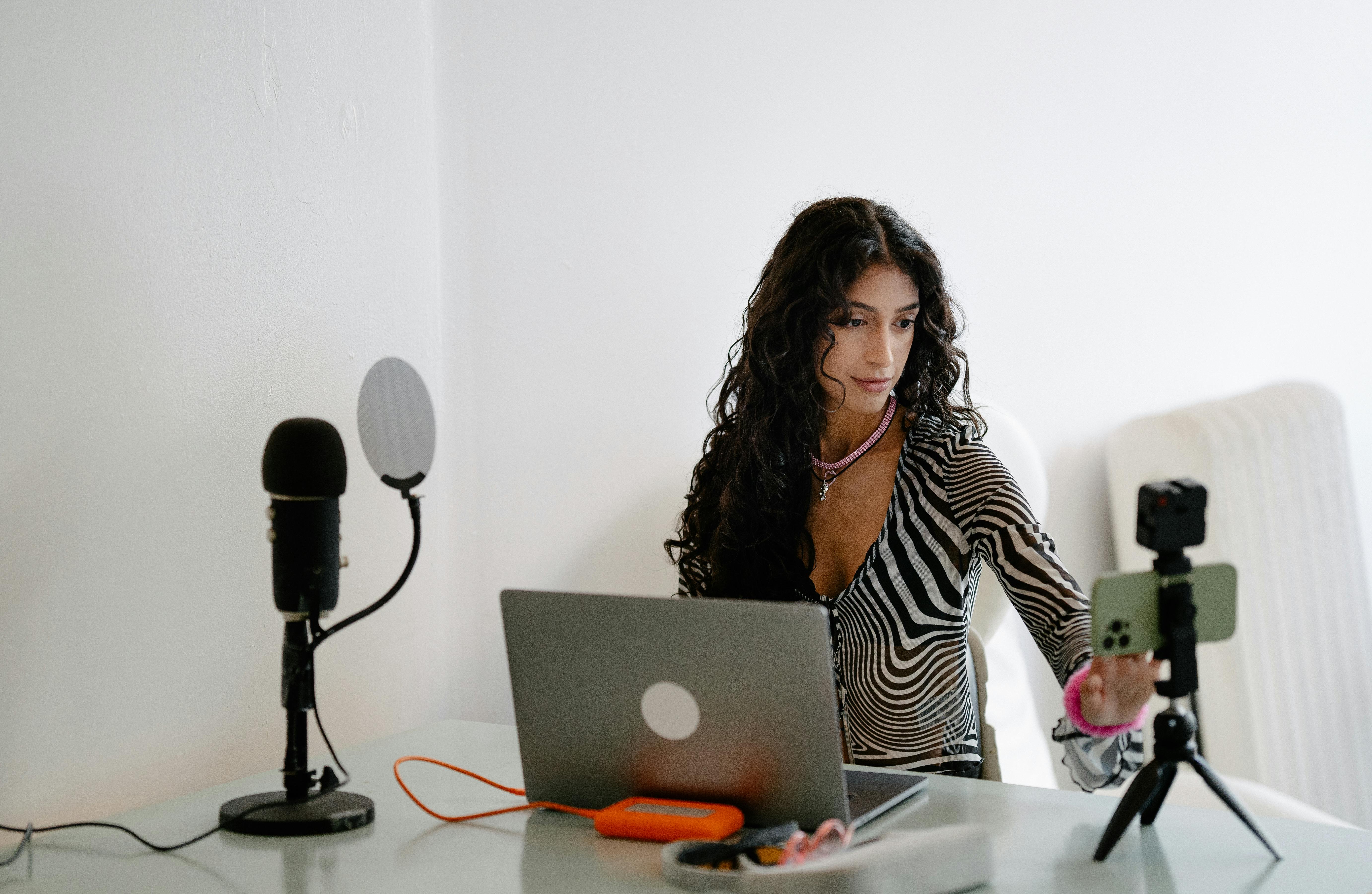 Woman Recording at Desk