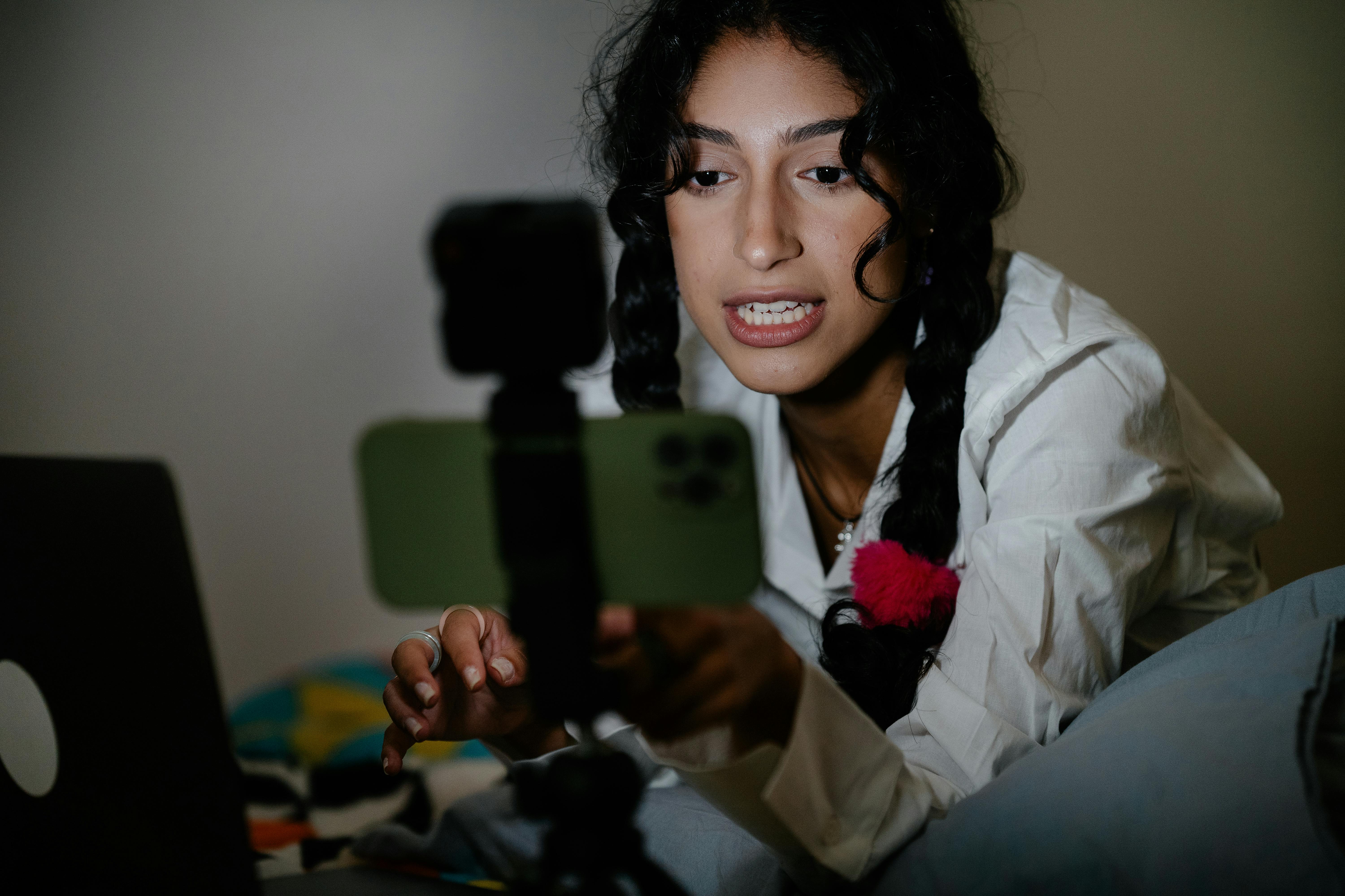 Woman with Braided Hair while Recording