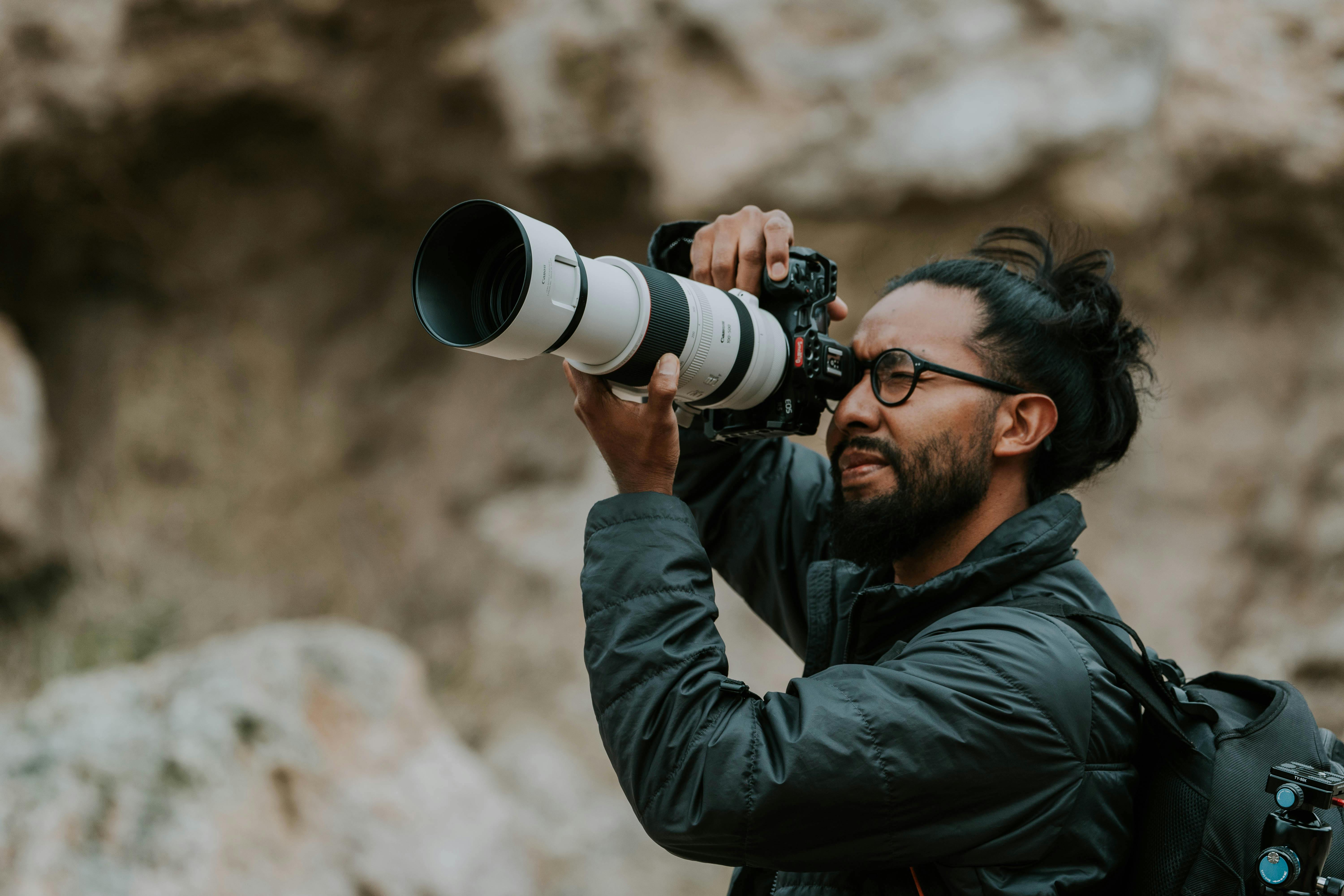 Photographer in a Mountain Valley