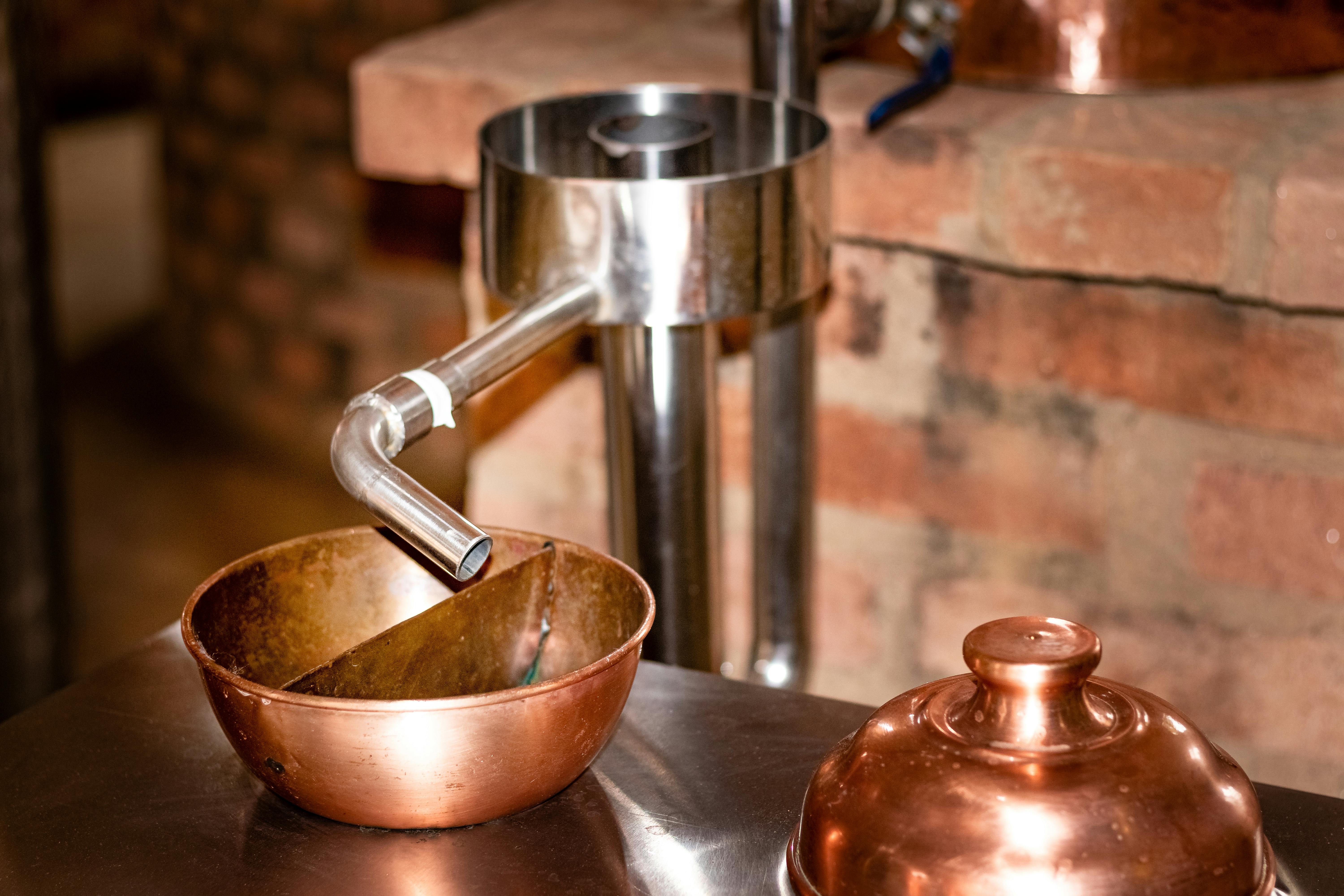 Copper Distillation Equipment in Rustic Setup