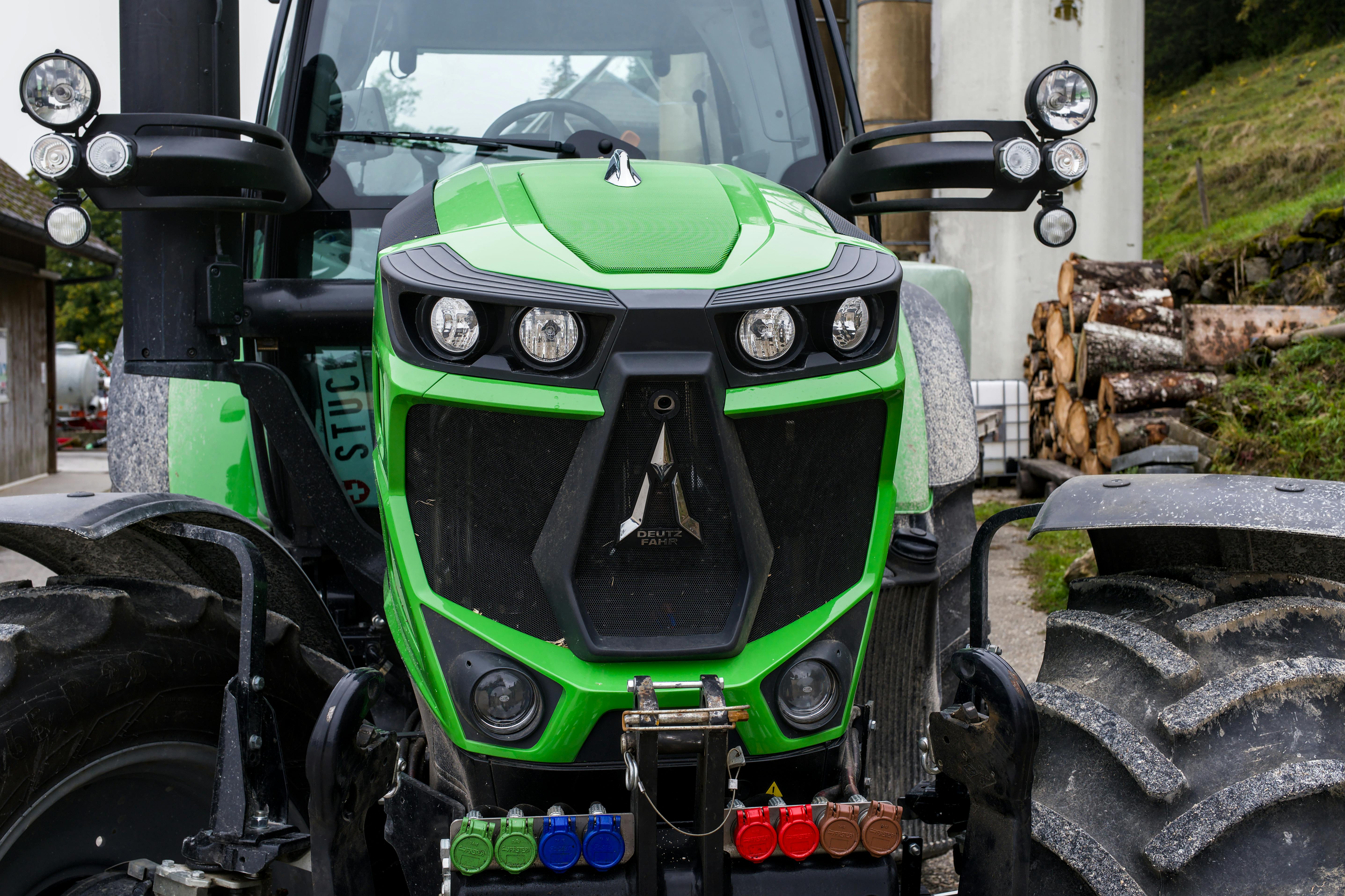 Close-up of Green Farm Tractor in Rustic Setting