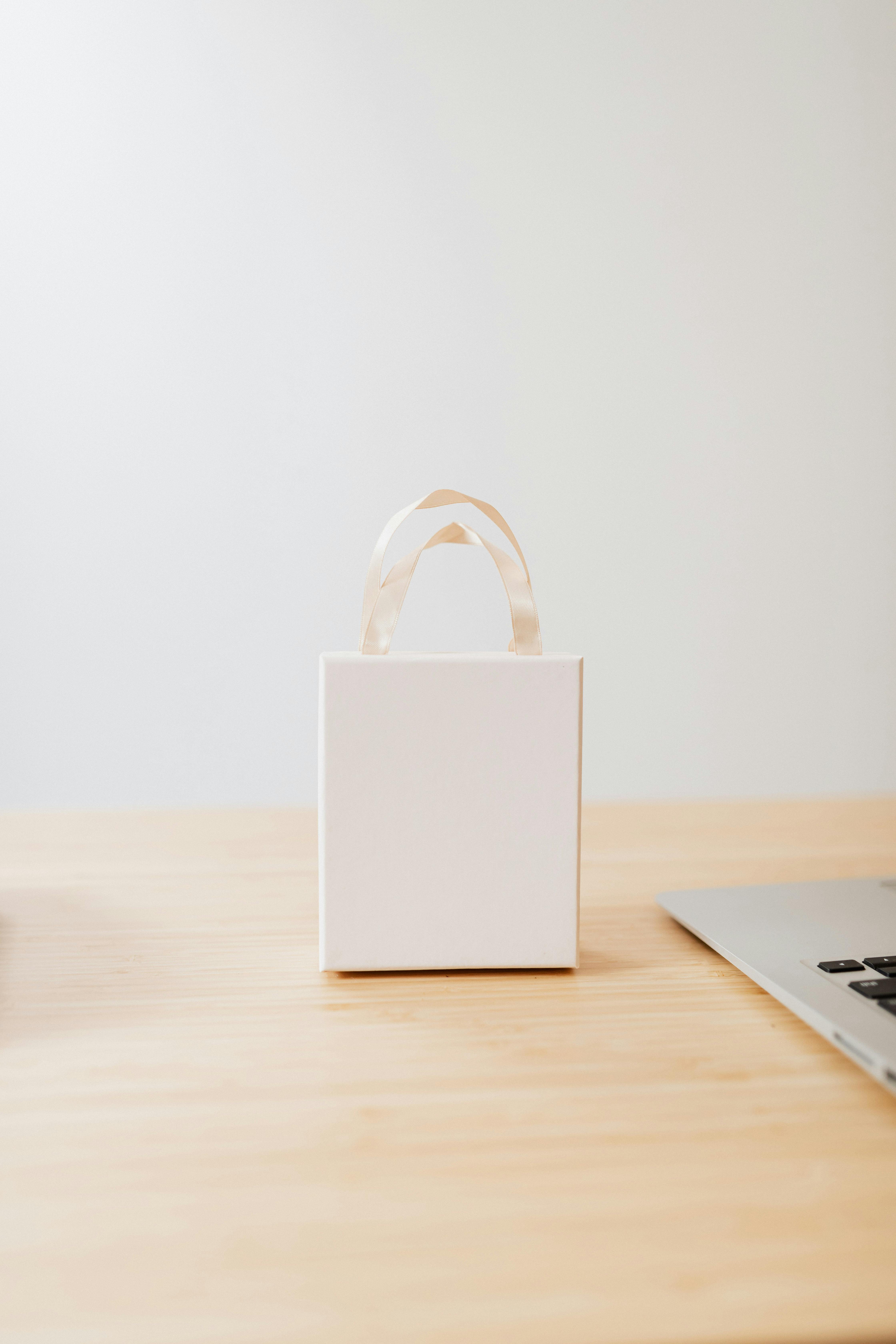 Small White Box on the Wooden Table Top