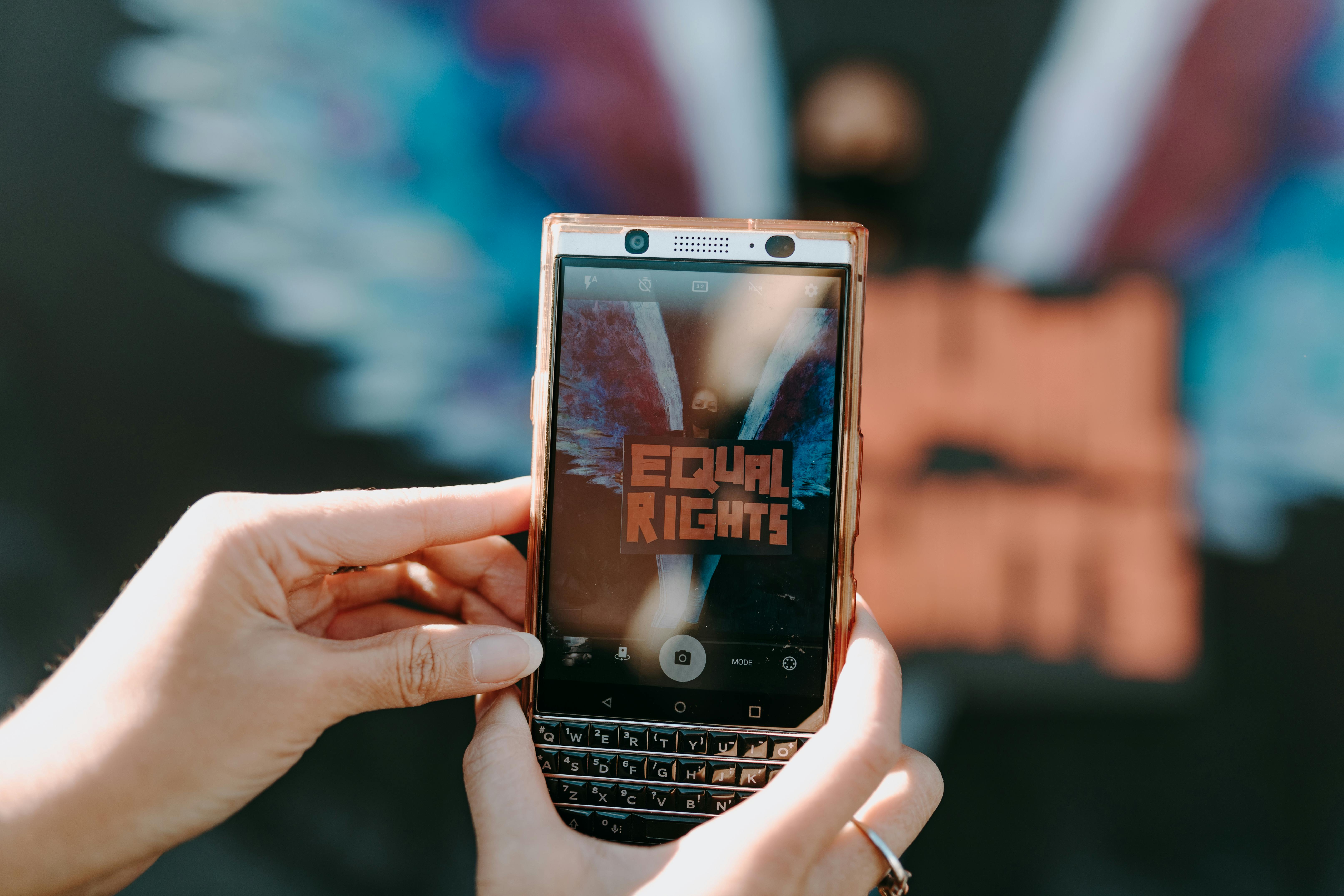 Close-Up Shot of a Person Taking Photo Using a Mobile Phone