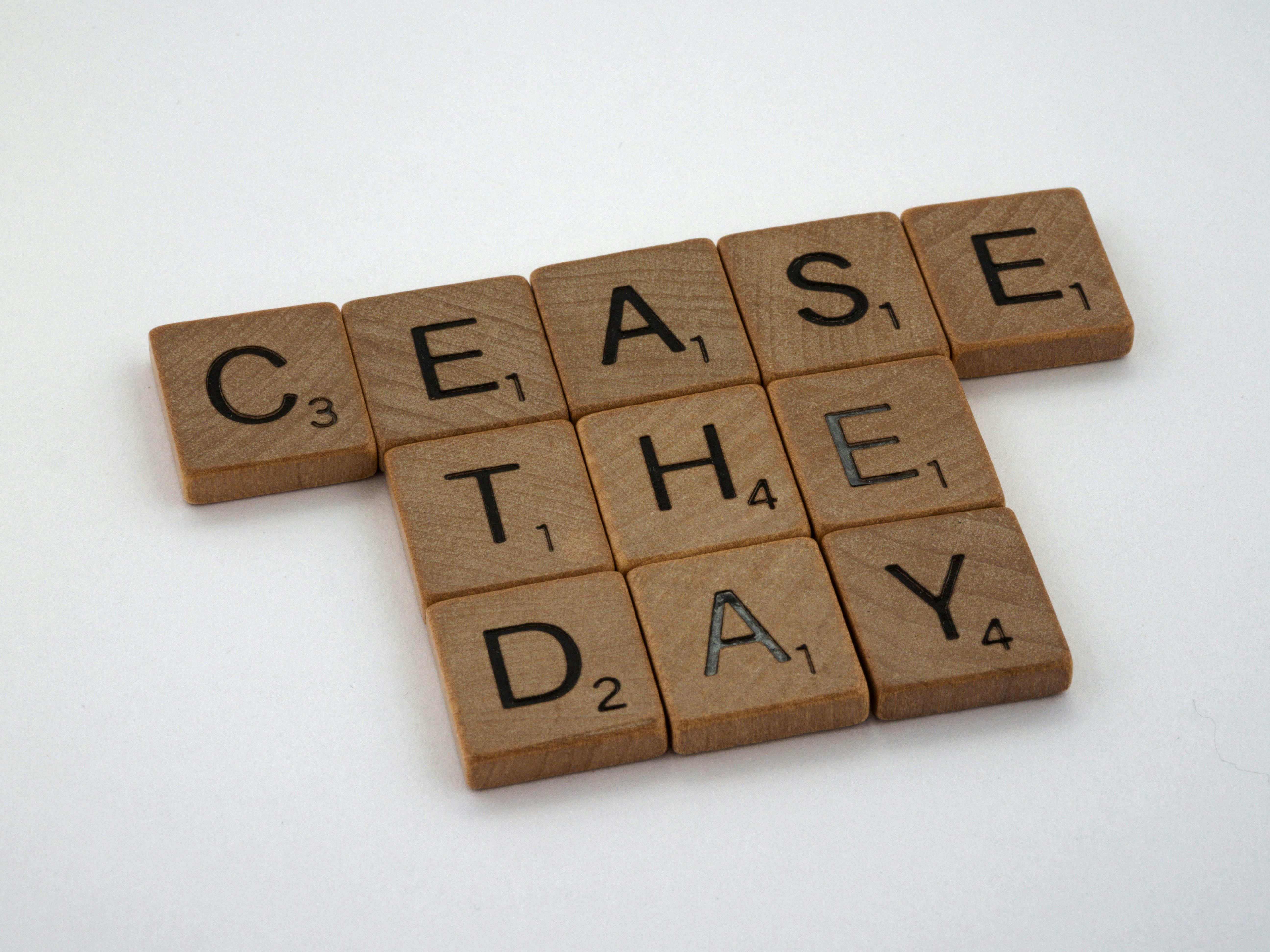 Brown Scrabble Tiles on the Table