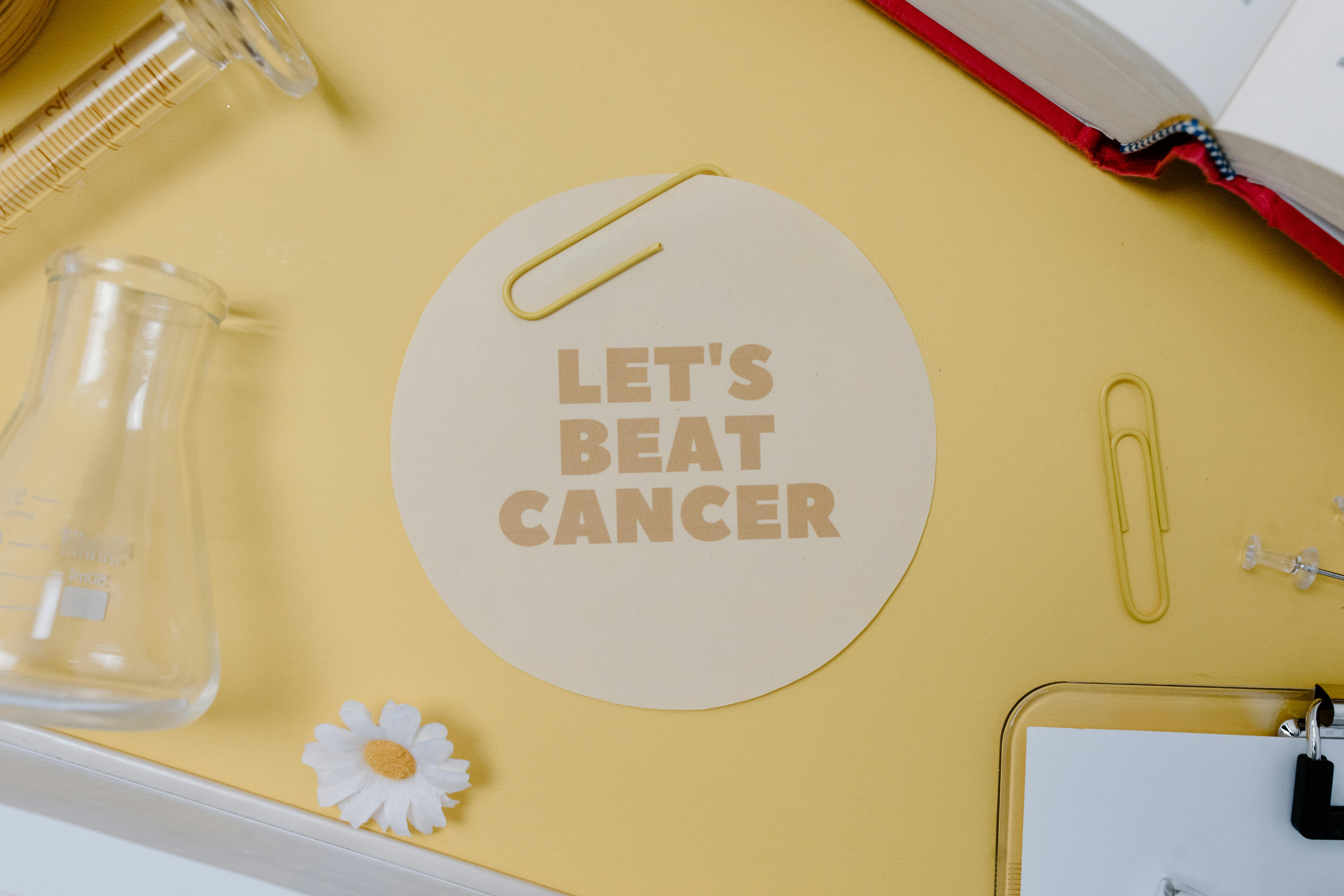 Let's Beat Cancer Slogan on a Round Paper