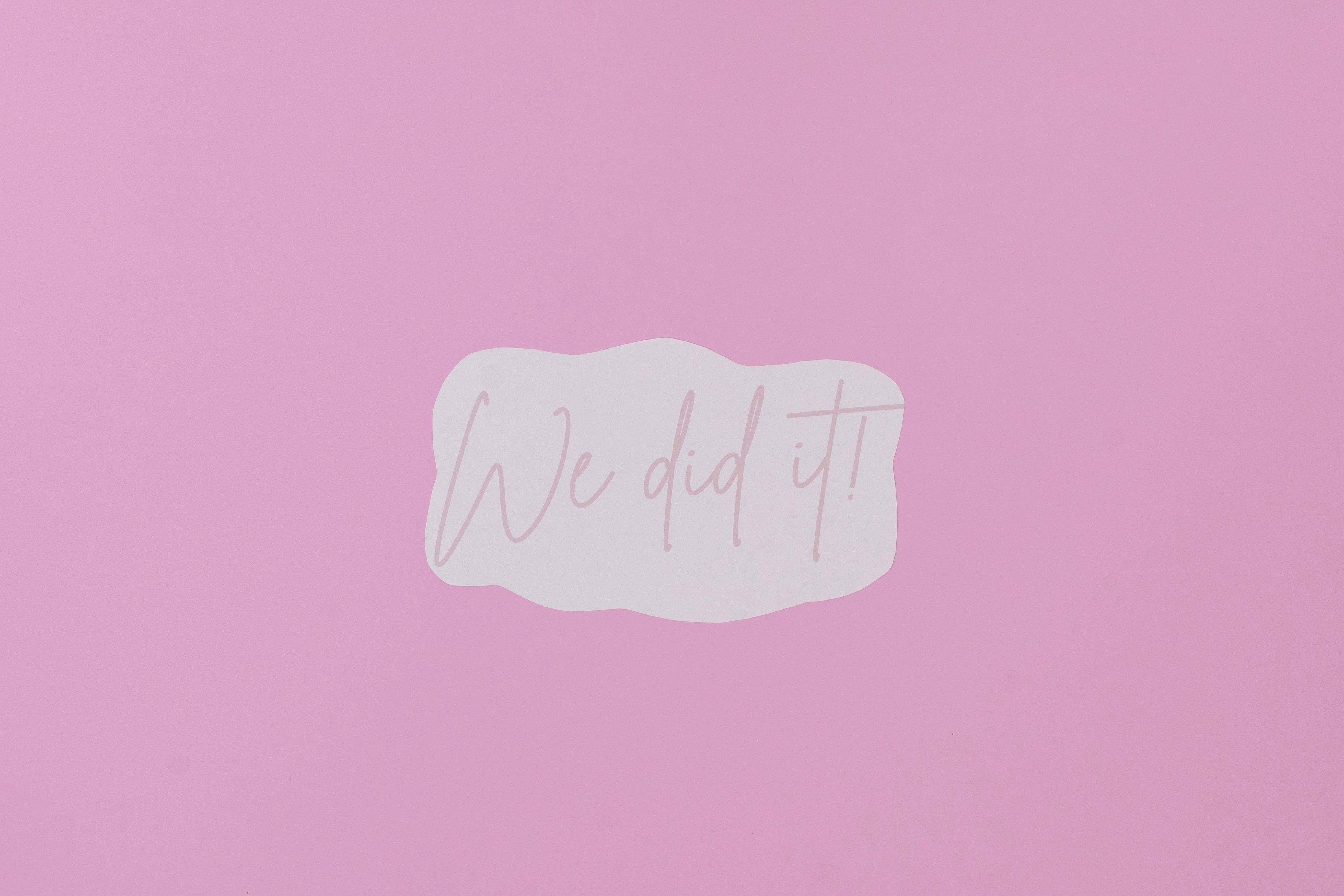 A Paper with We Did It Message on Purple background