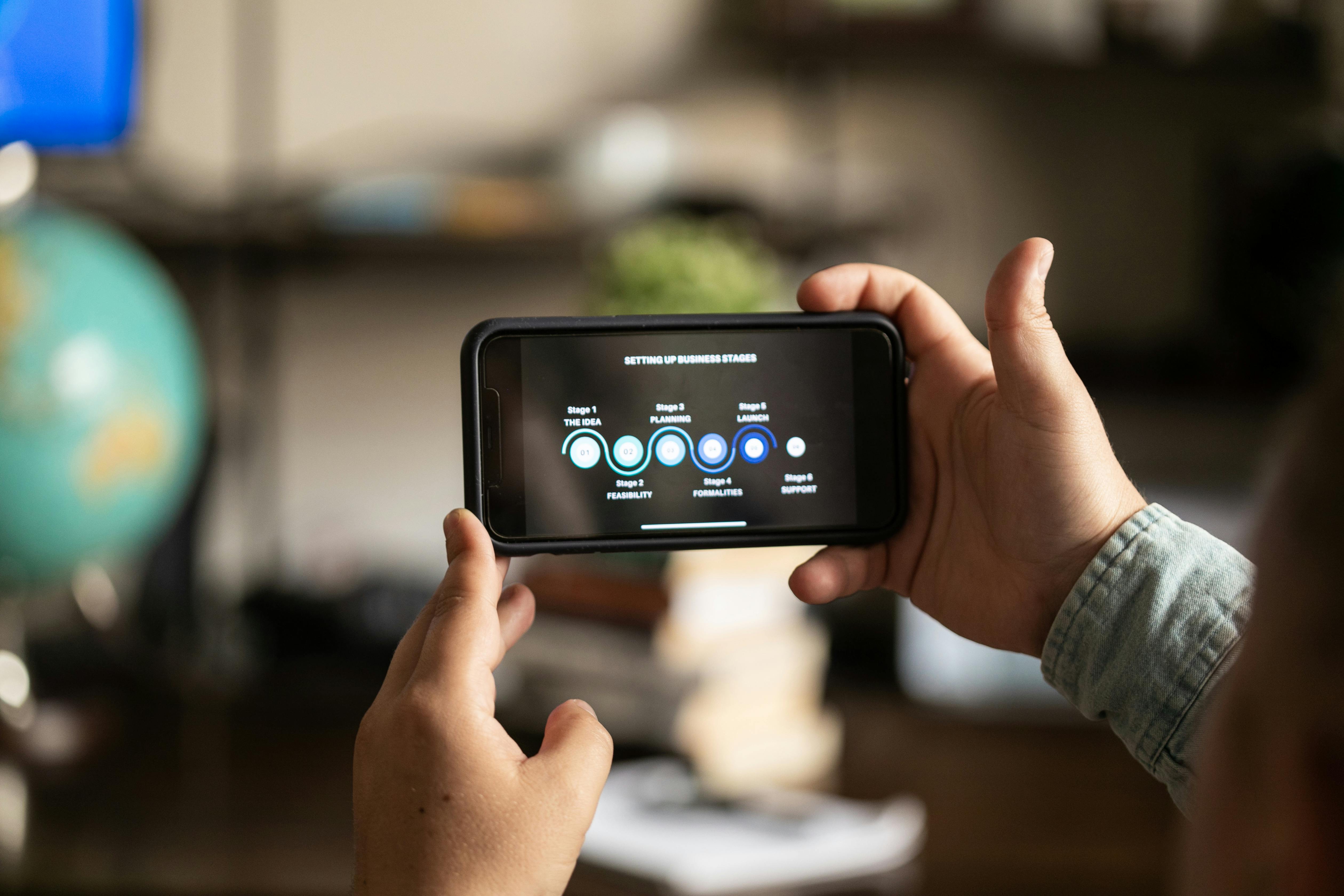 Close-Up Shot of a Person Holding a Smartphone