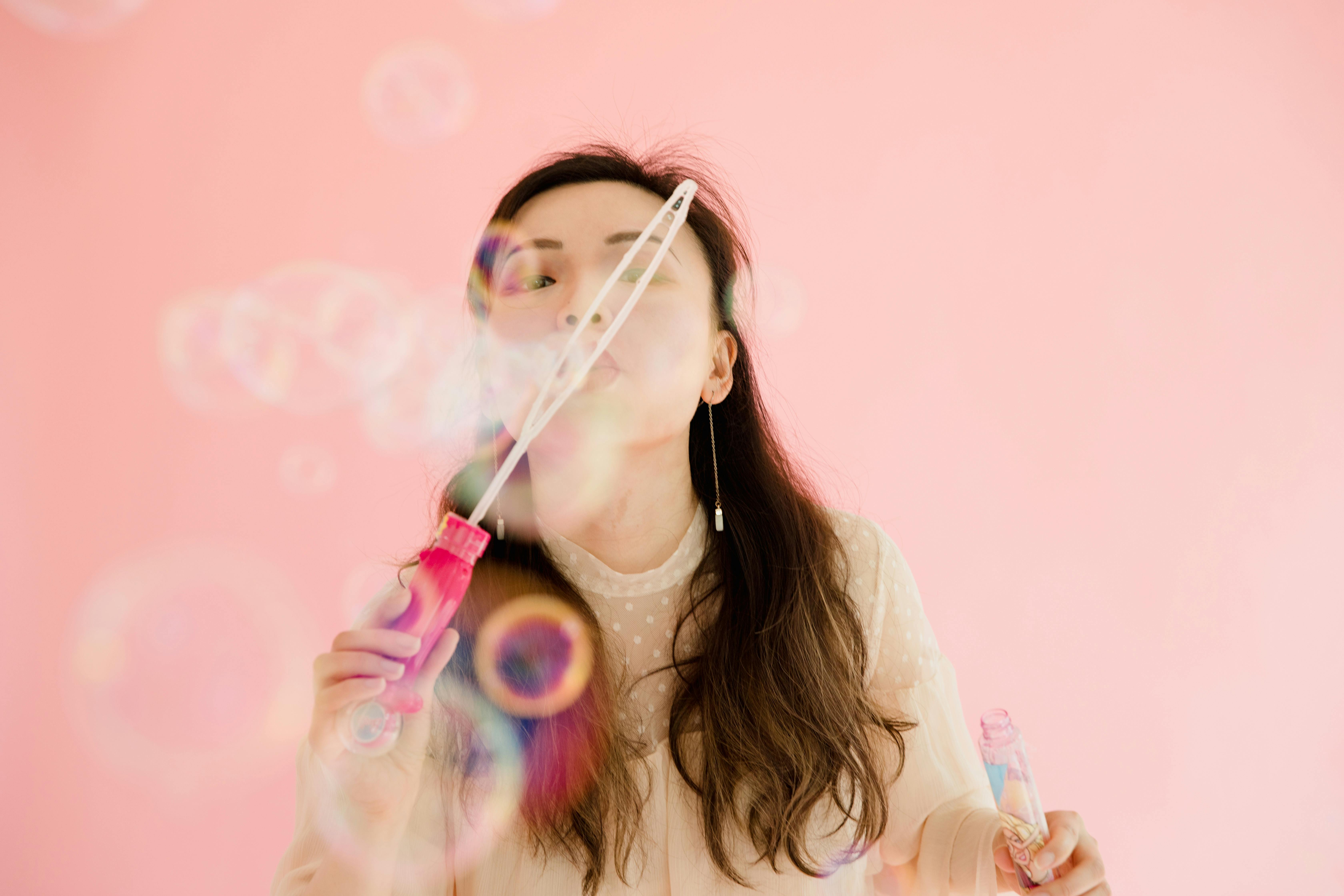 A Woman Blowing Bubbles