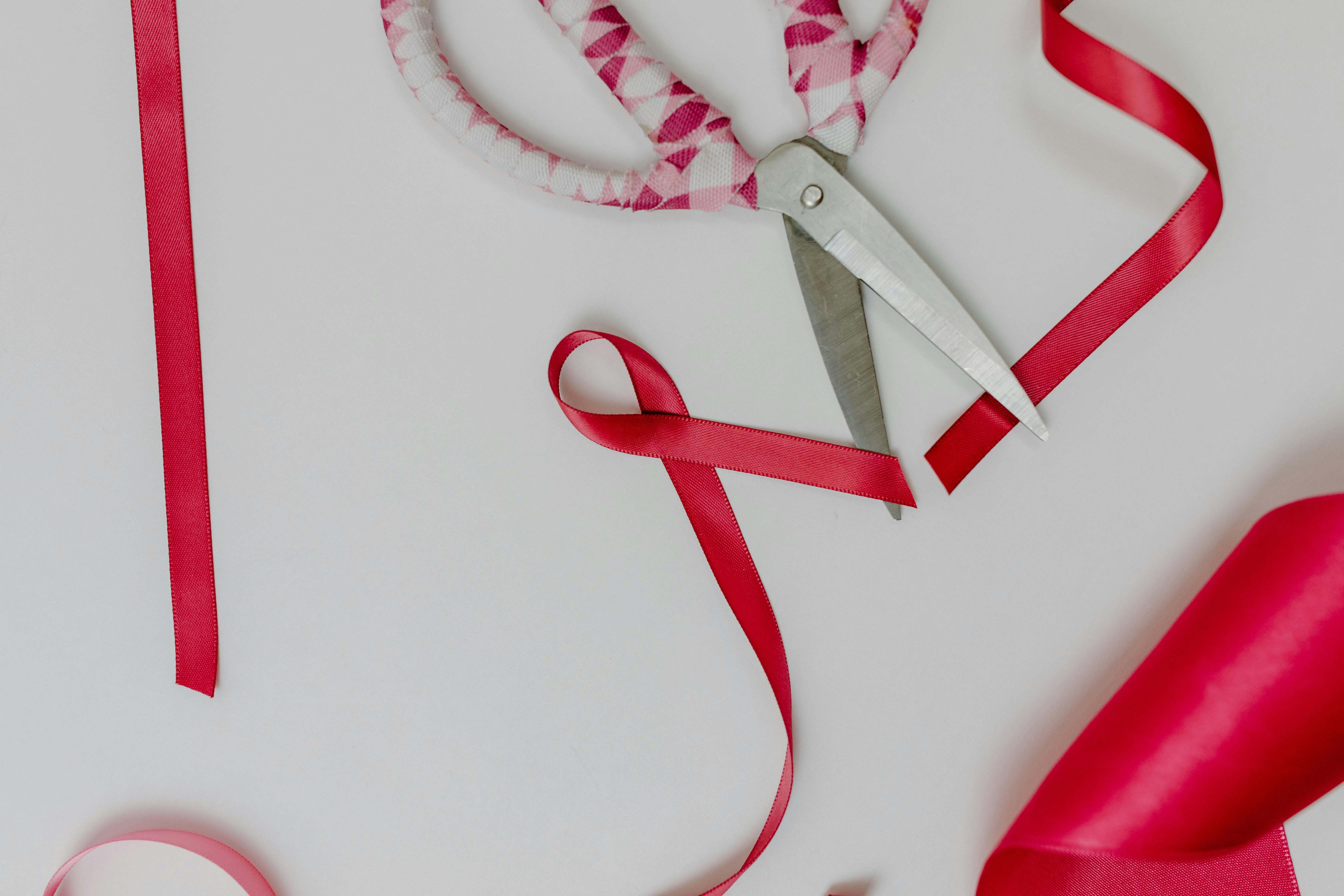 White and Pink Scissors on the Table