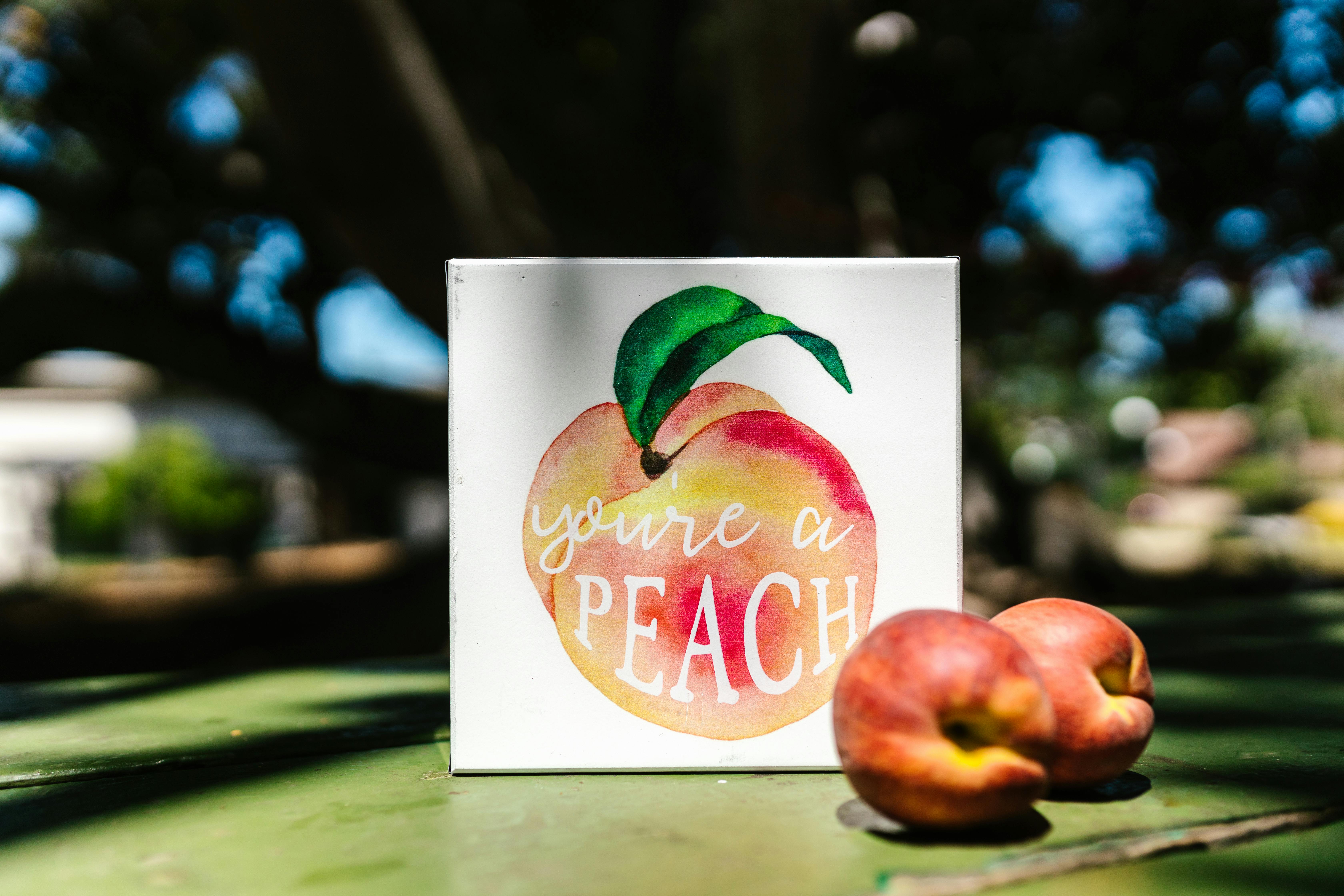 A Peach Artwork beside Peaches