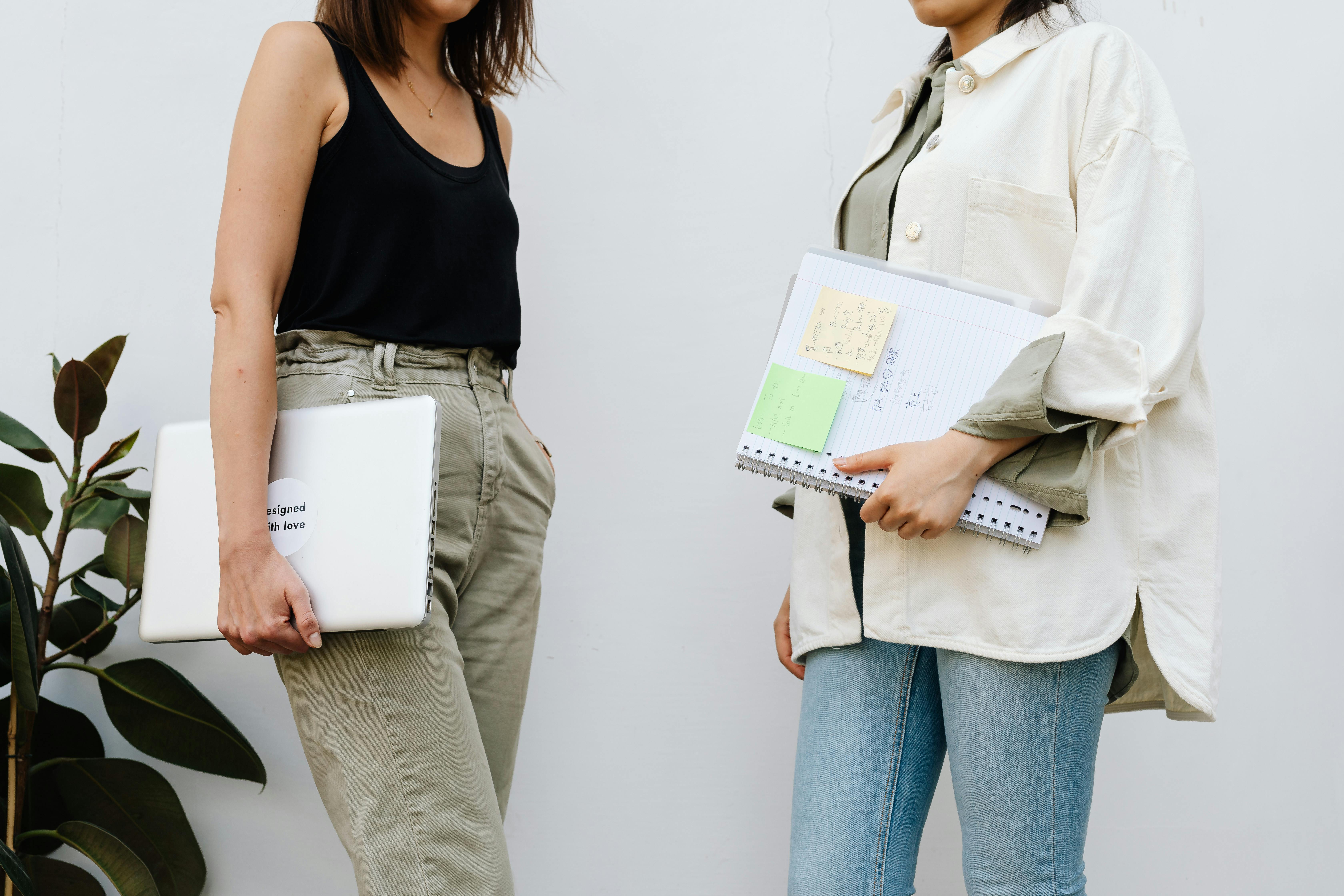 Women Talking in an Office Hallway