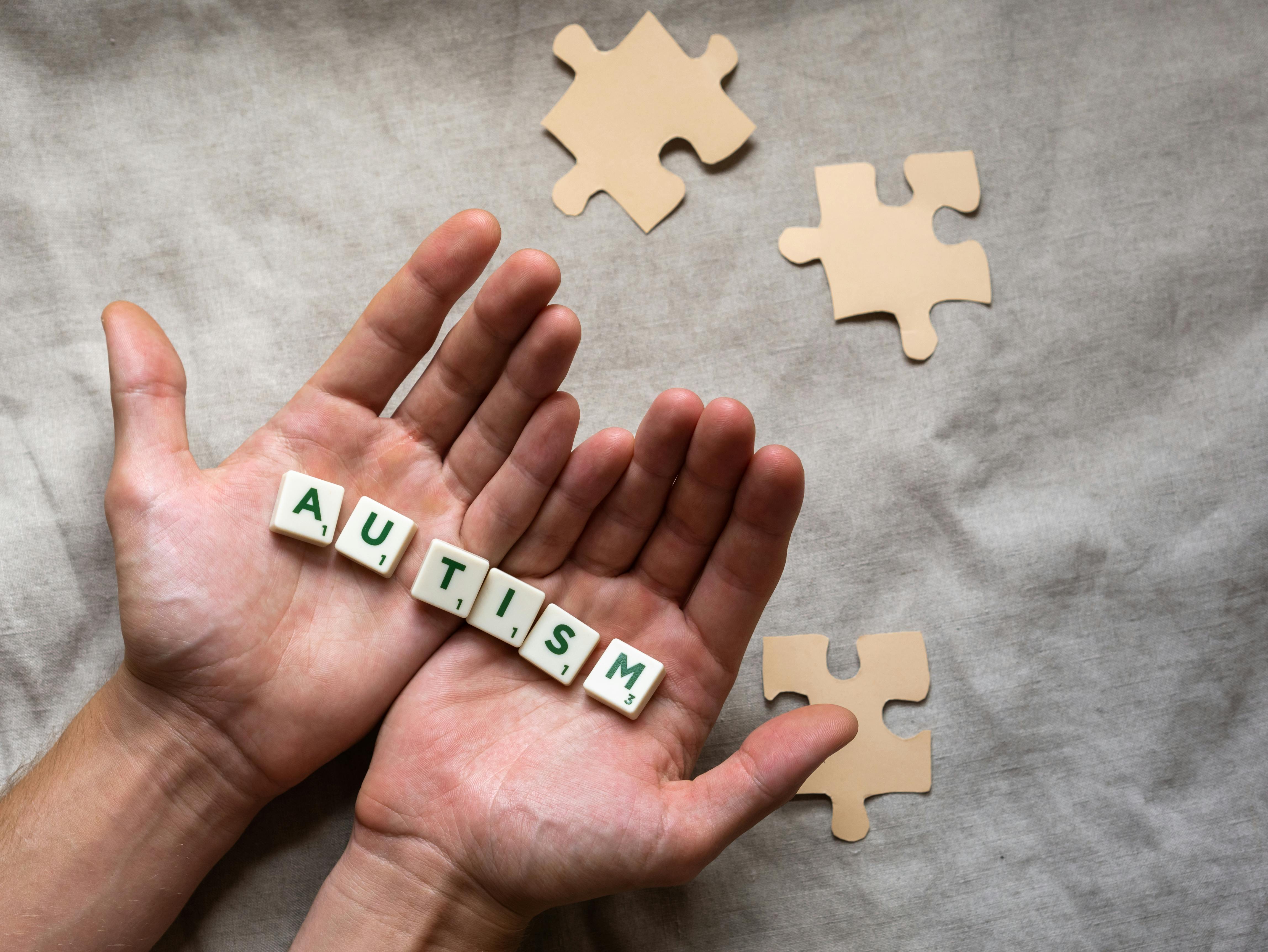 Person Holding Scrabble Tiles