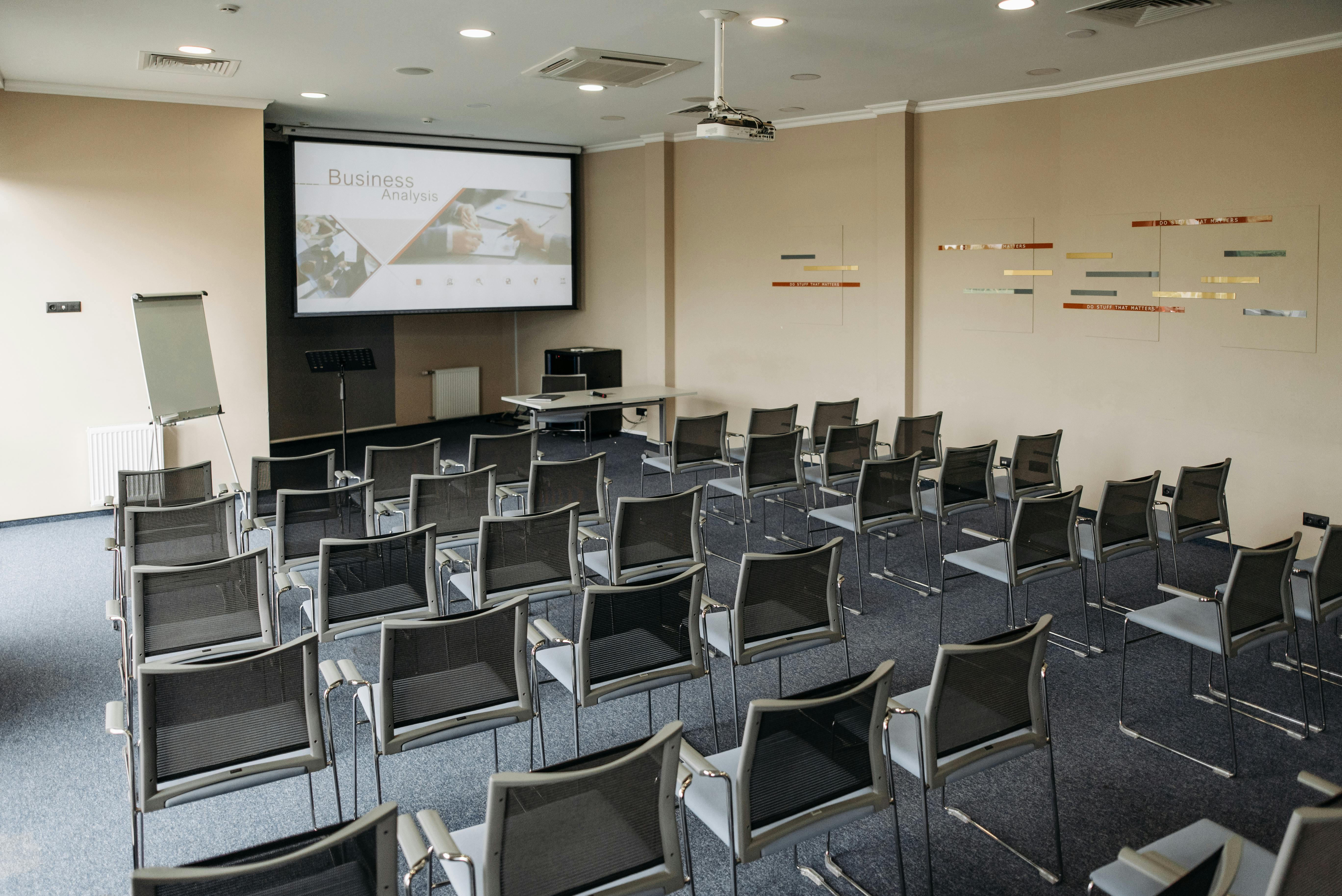 A Room with Seats and an Image on the Screen Projector