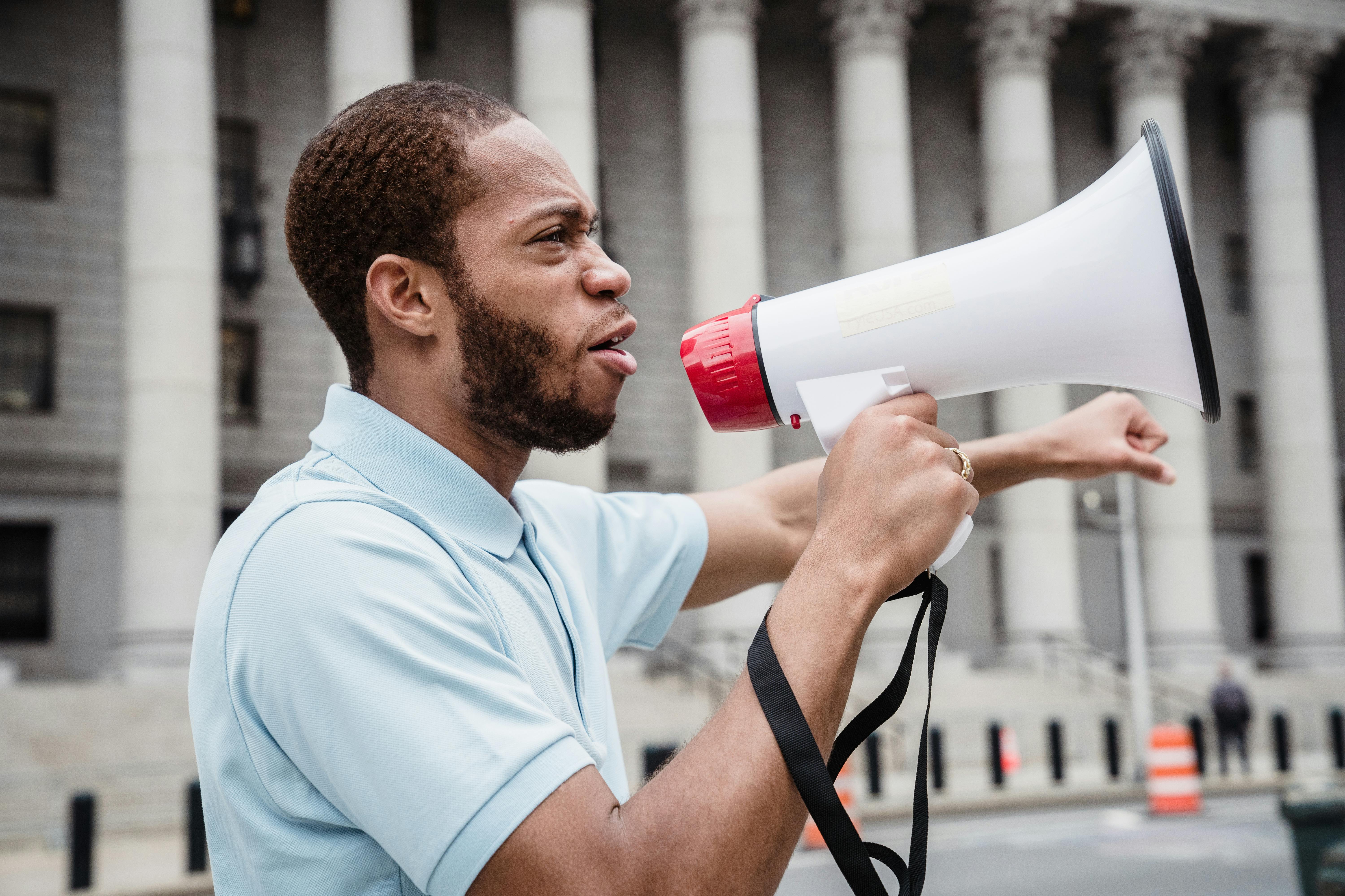 Male Protester holding Megaphone
