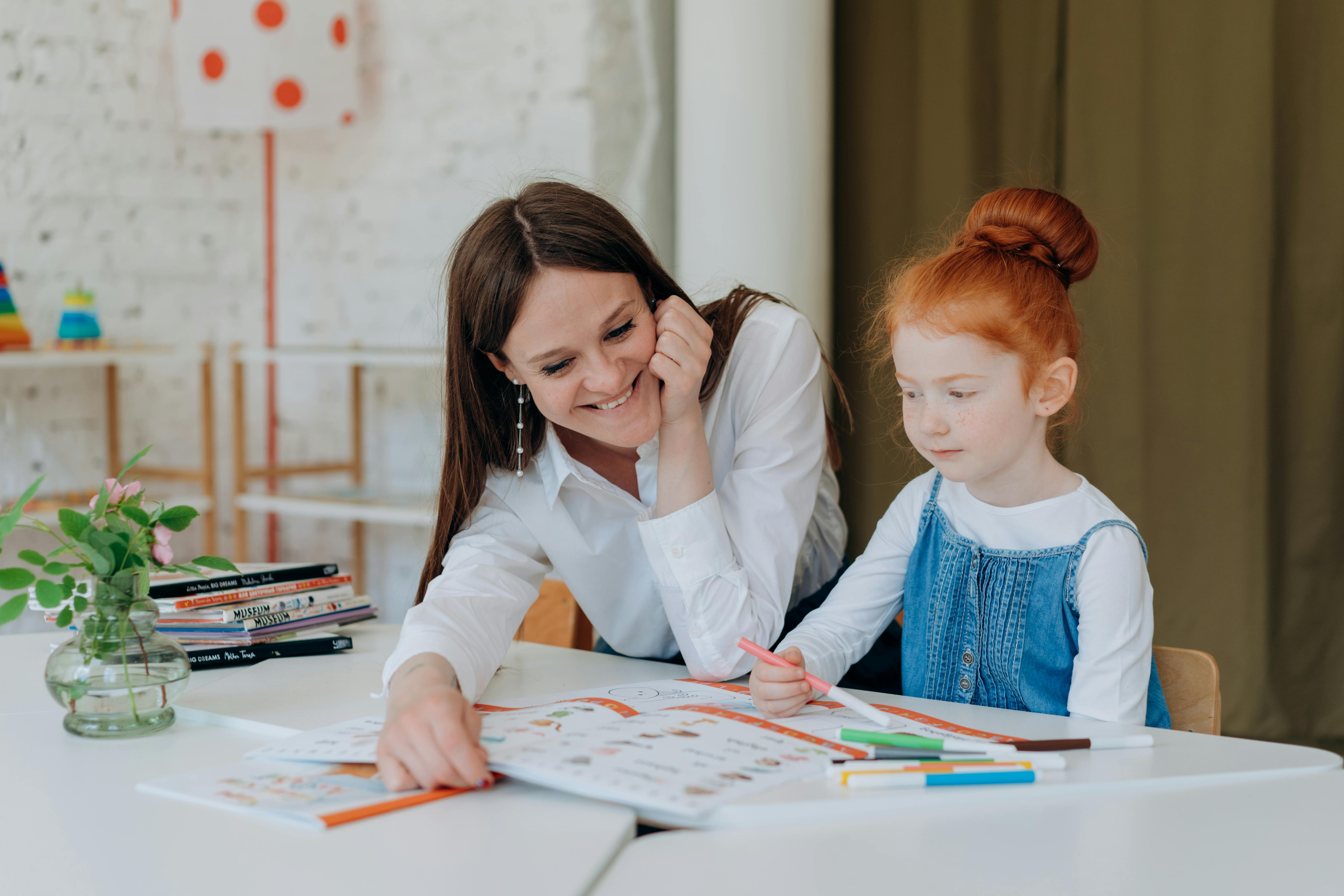 Mother Helping Daughter with her Homework 