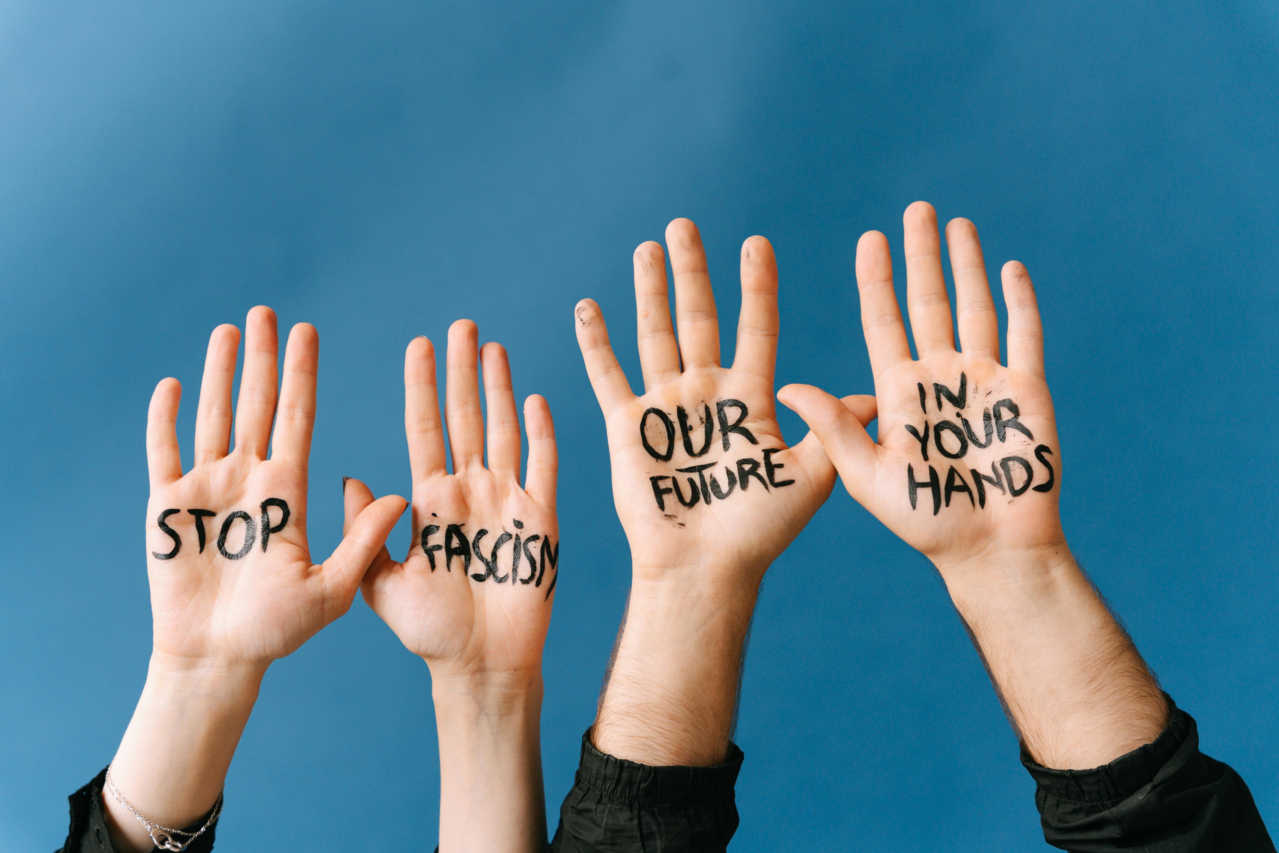 Hands with Message Stop Fascism Our Future in Your Hands