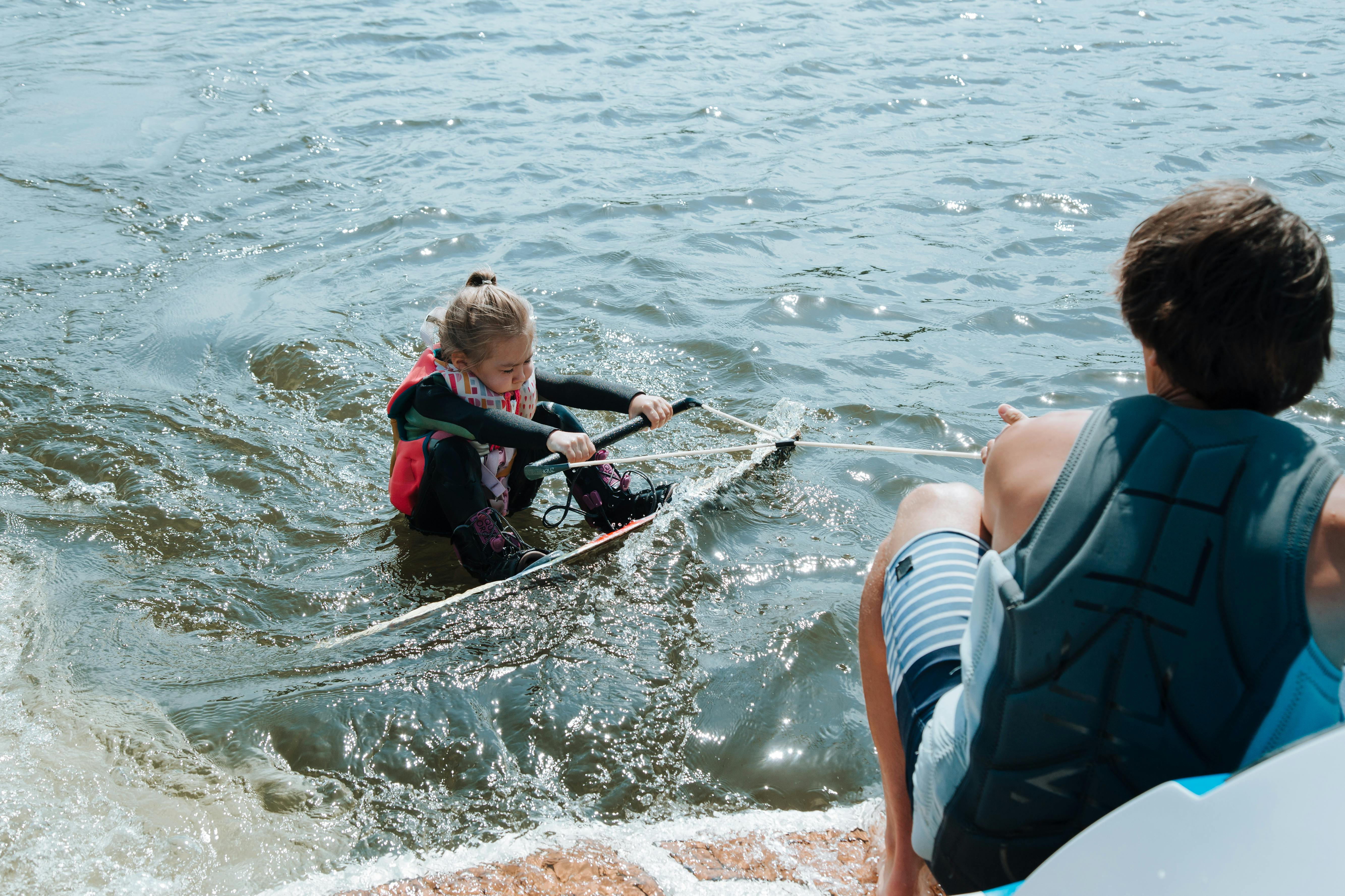 A Father and Daughter Doing Watersport