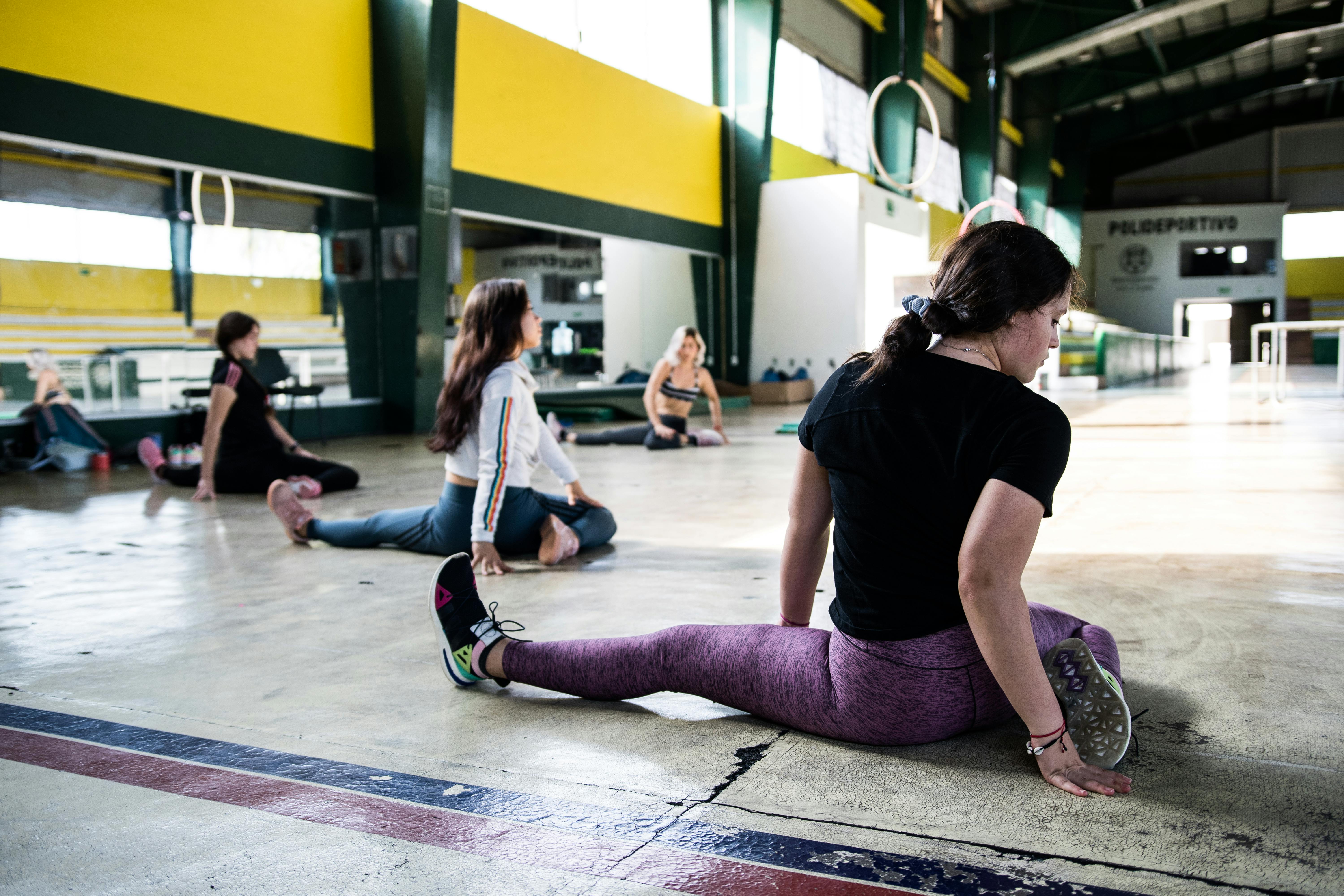 Women Stretching at Fitness Exercises