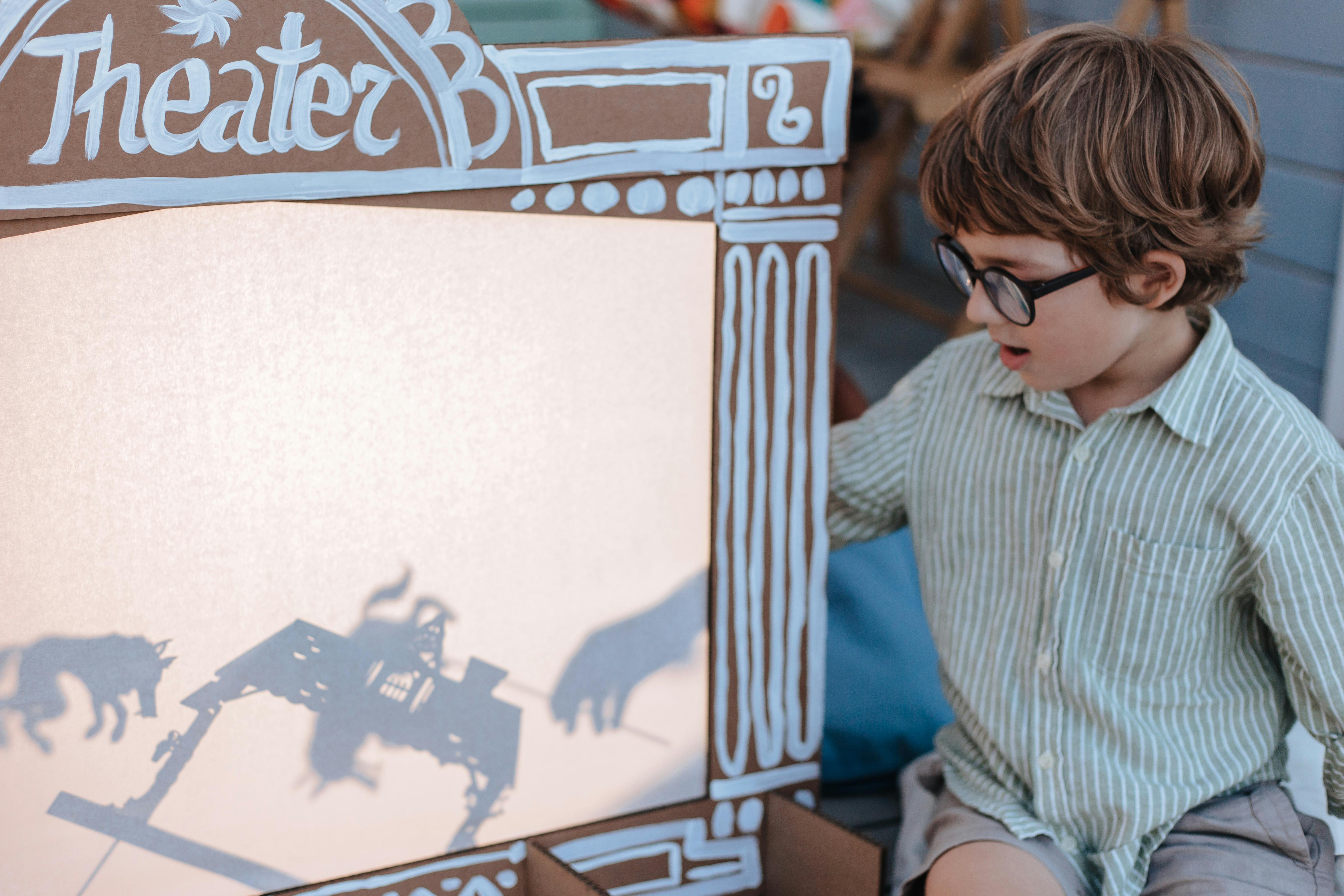 Boy Playing Shadow Theatre