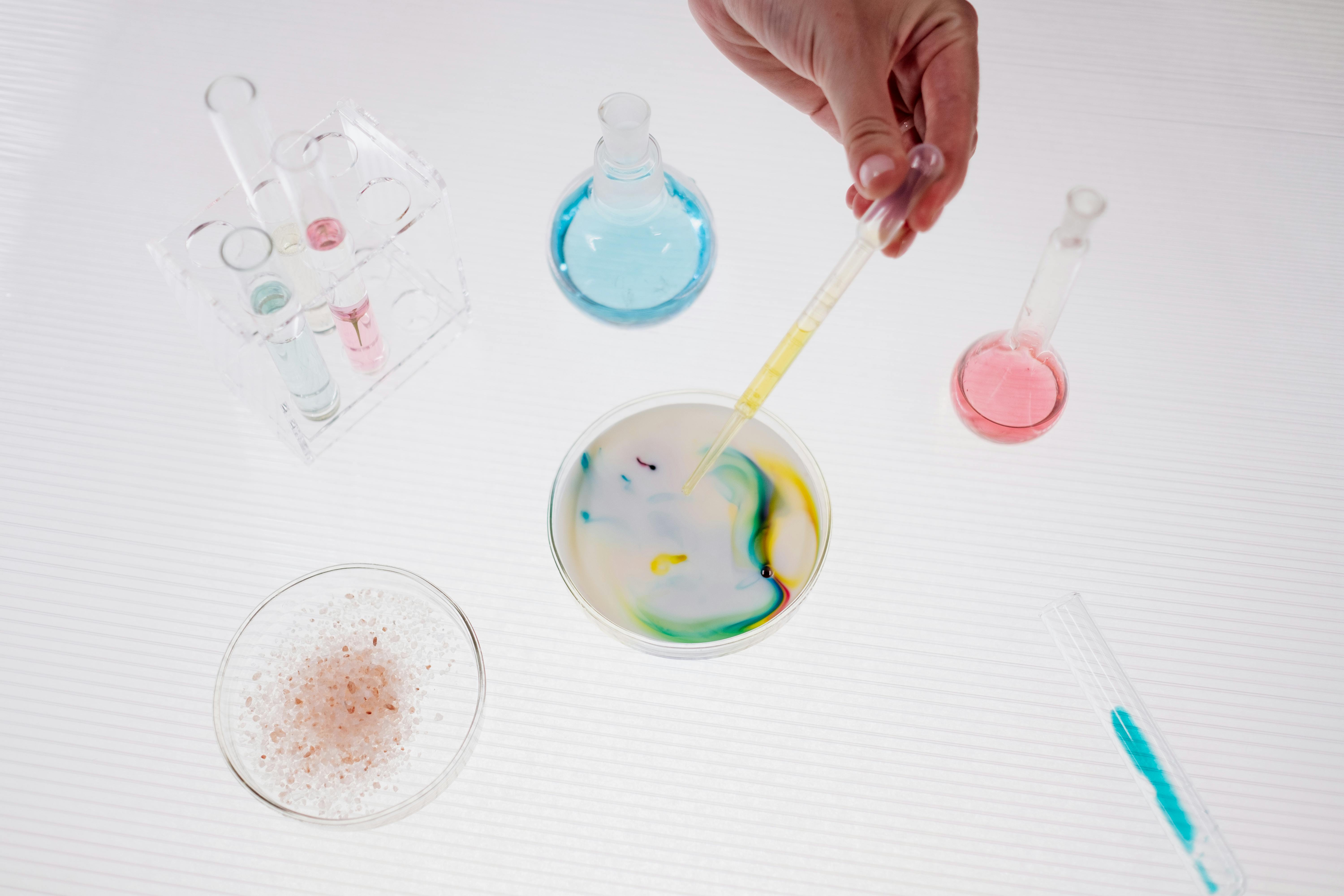 Woman Hand Making Chemistry Experiment