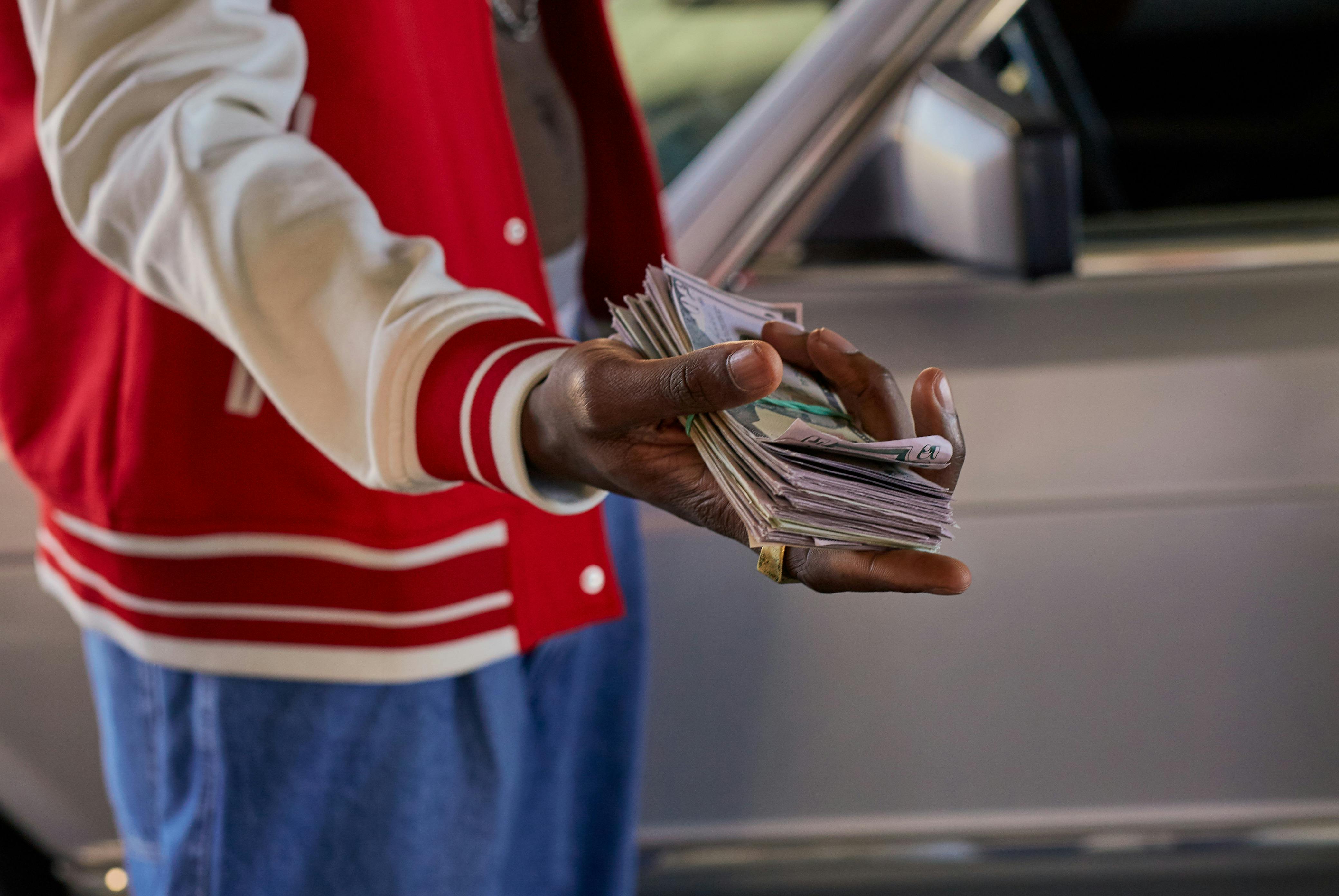 Man with Handful of Dollars