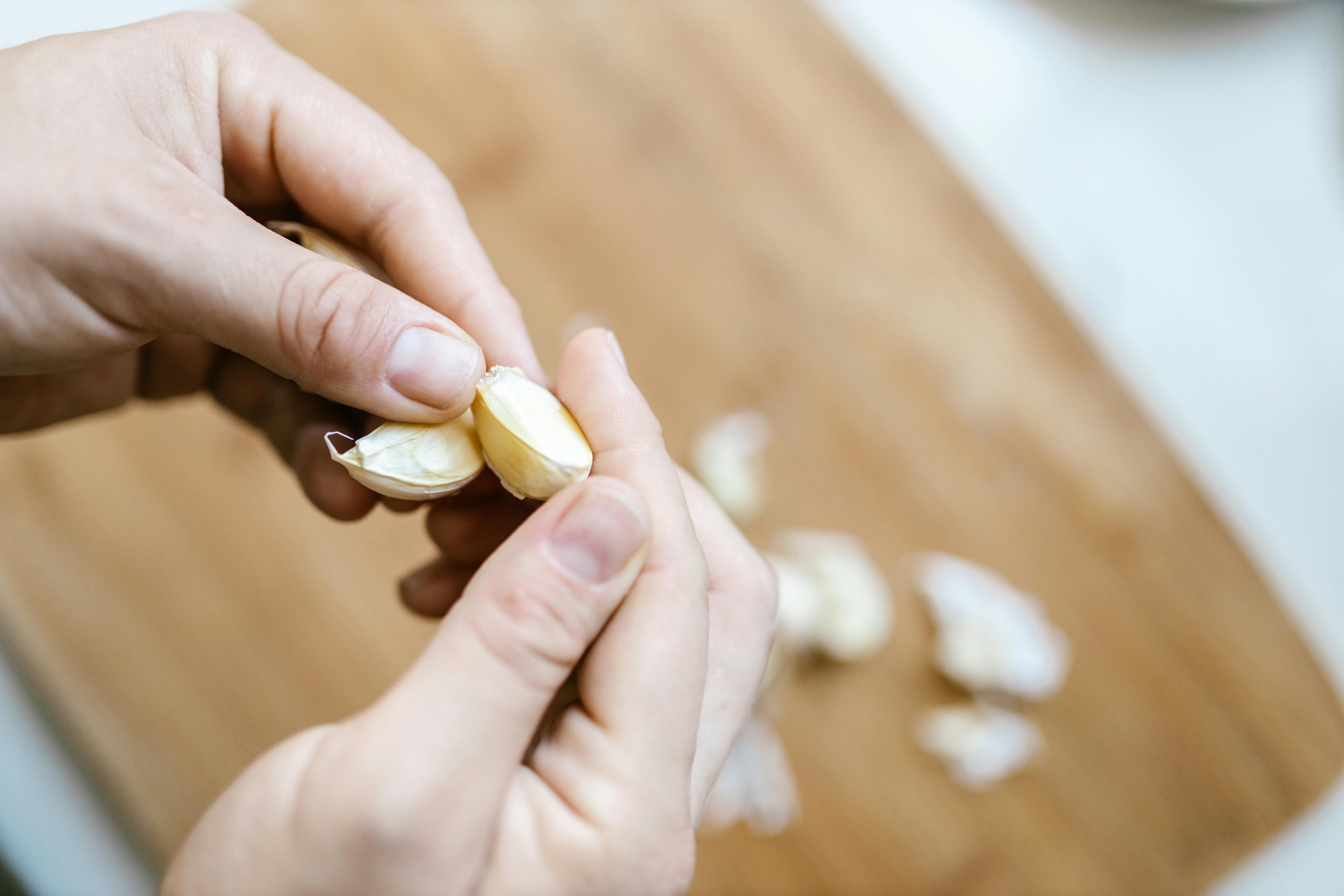 Hands Holding Garlic