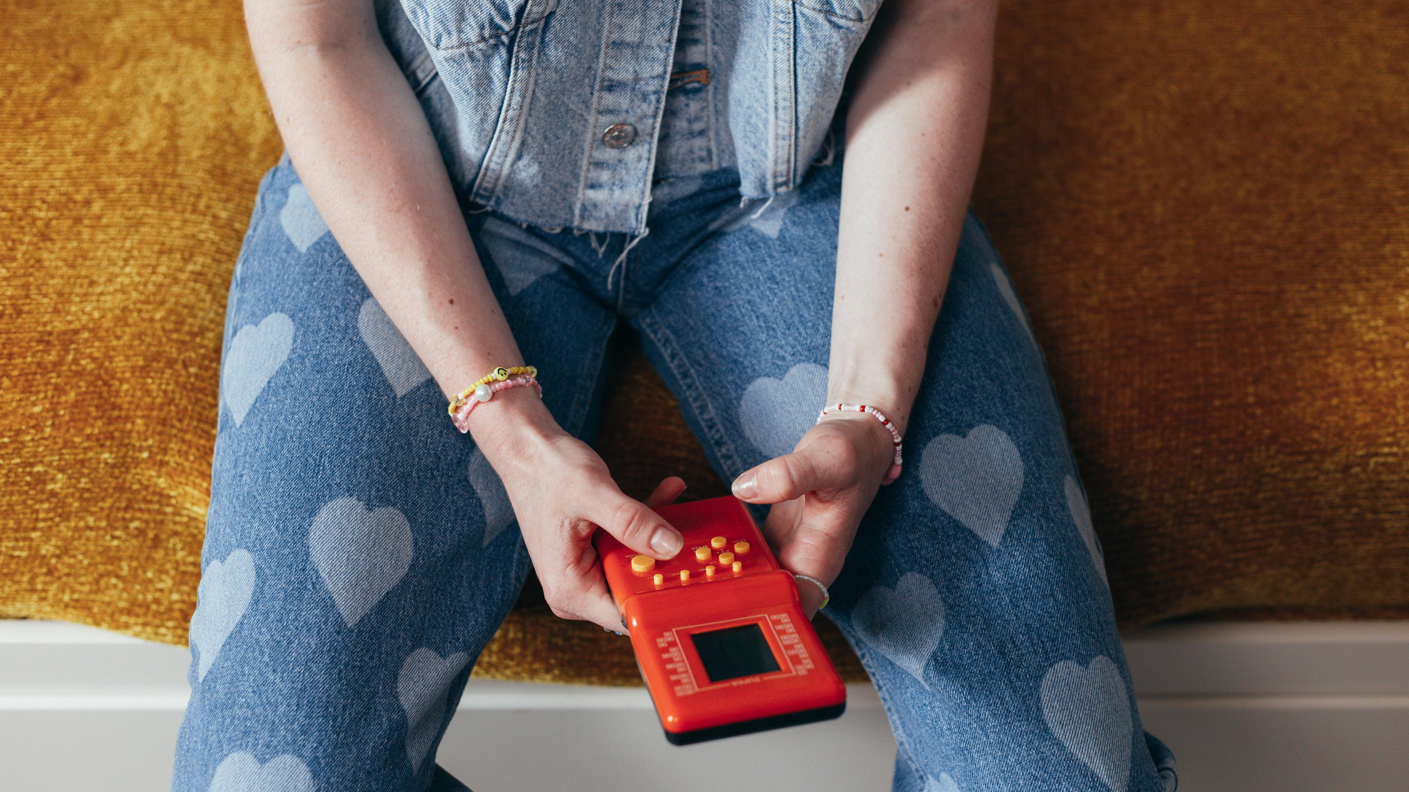 Person Holding Video Game Console