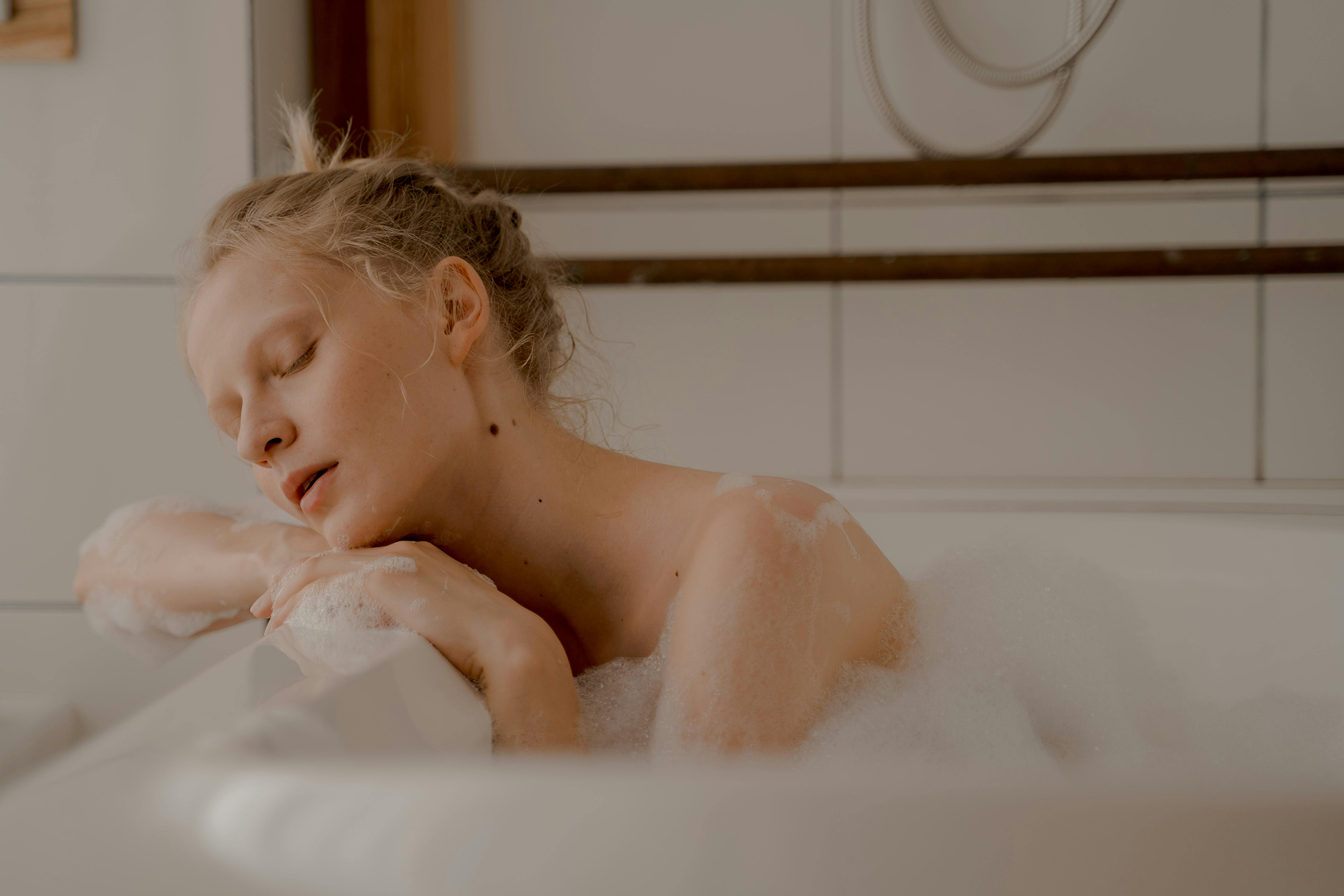Woman with Closed Eyes in Bathtub
