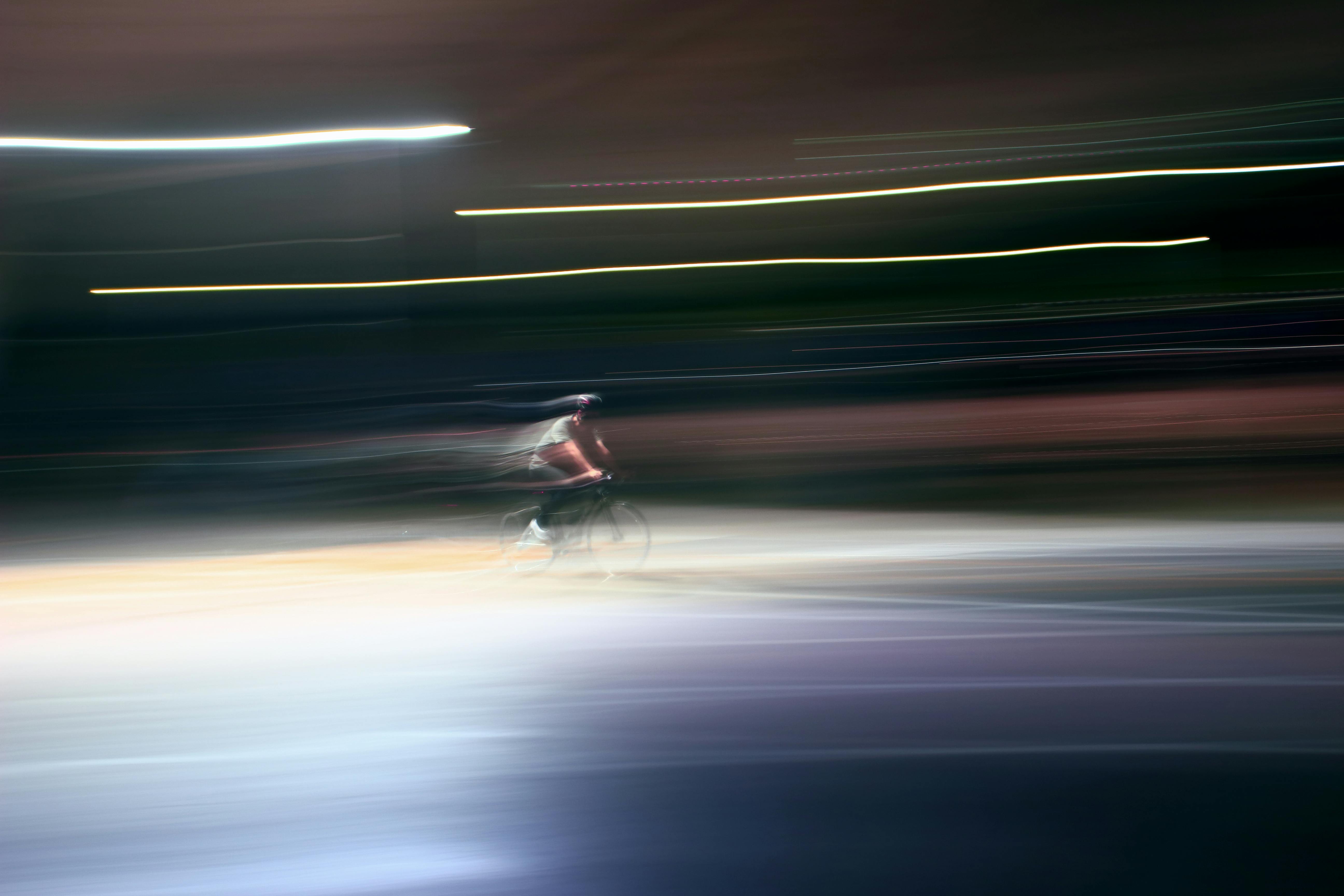 Blurred Motion of Man Riding Bike