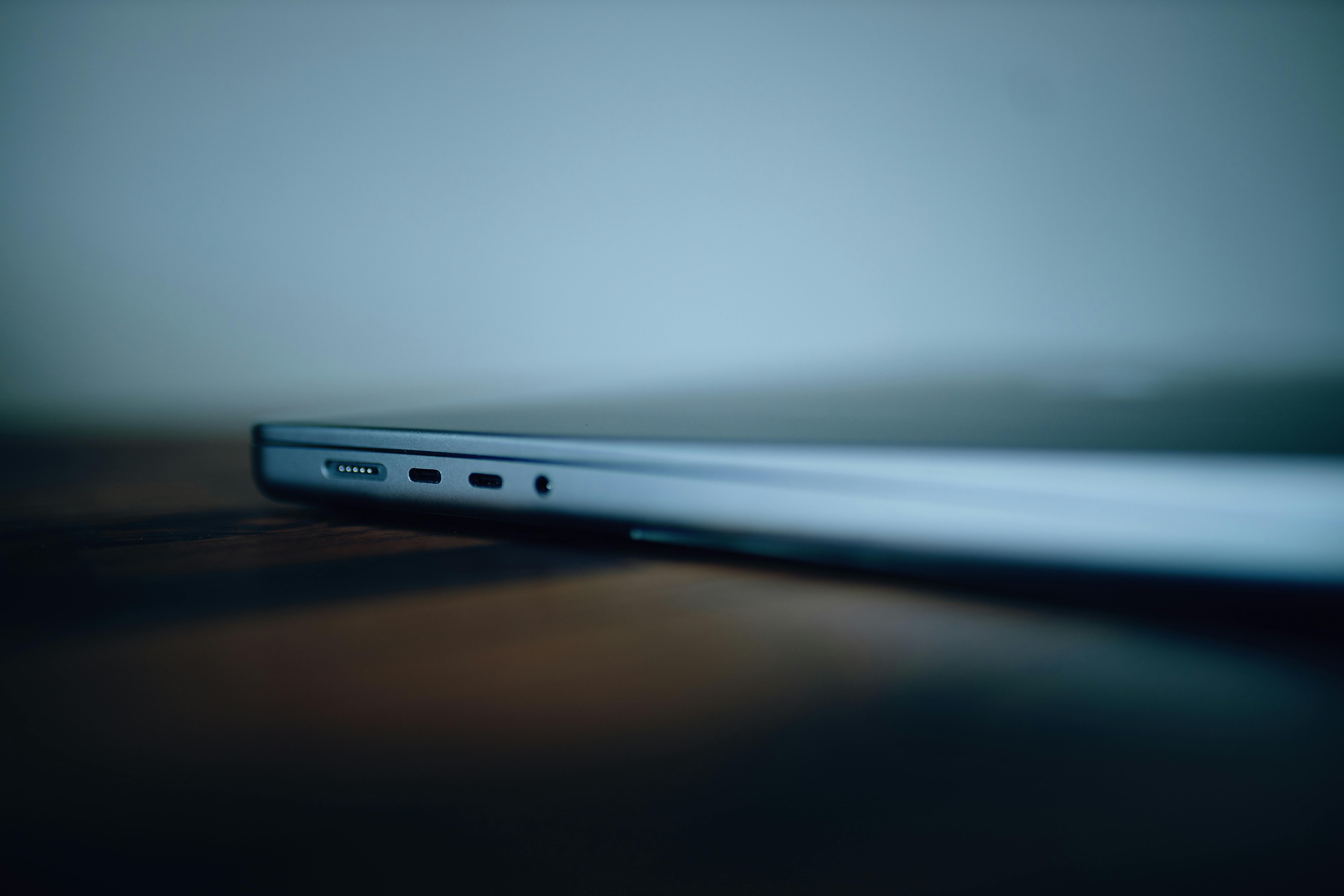 Silver Laptop on Brown Wooden Table