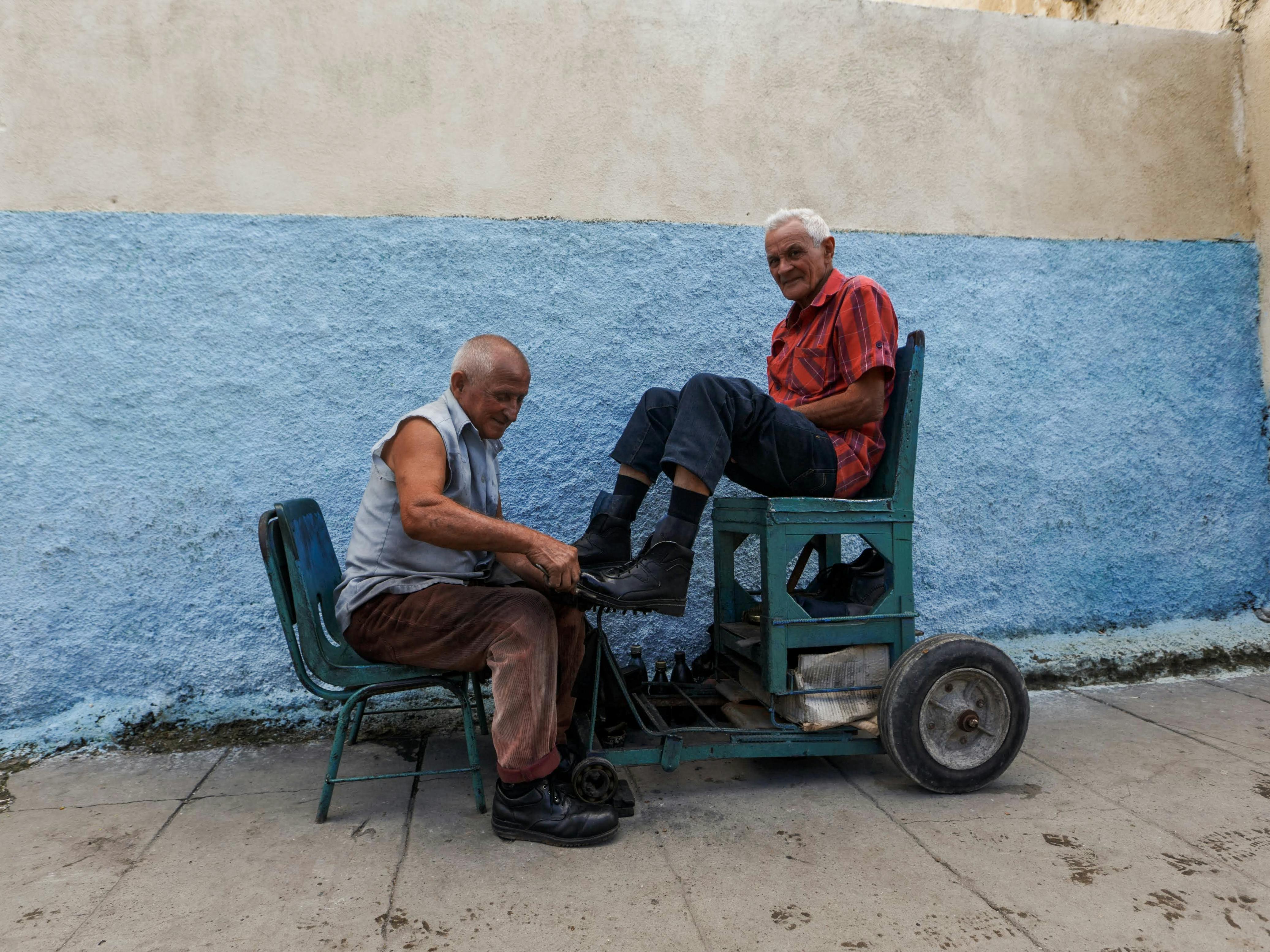 A Bootblack Cleaning Mans Shoes