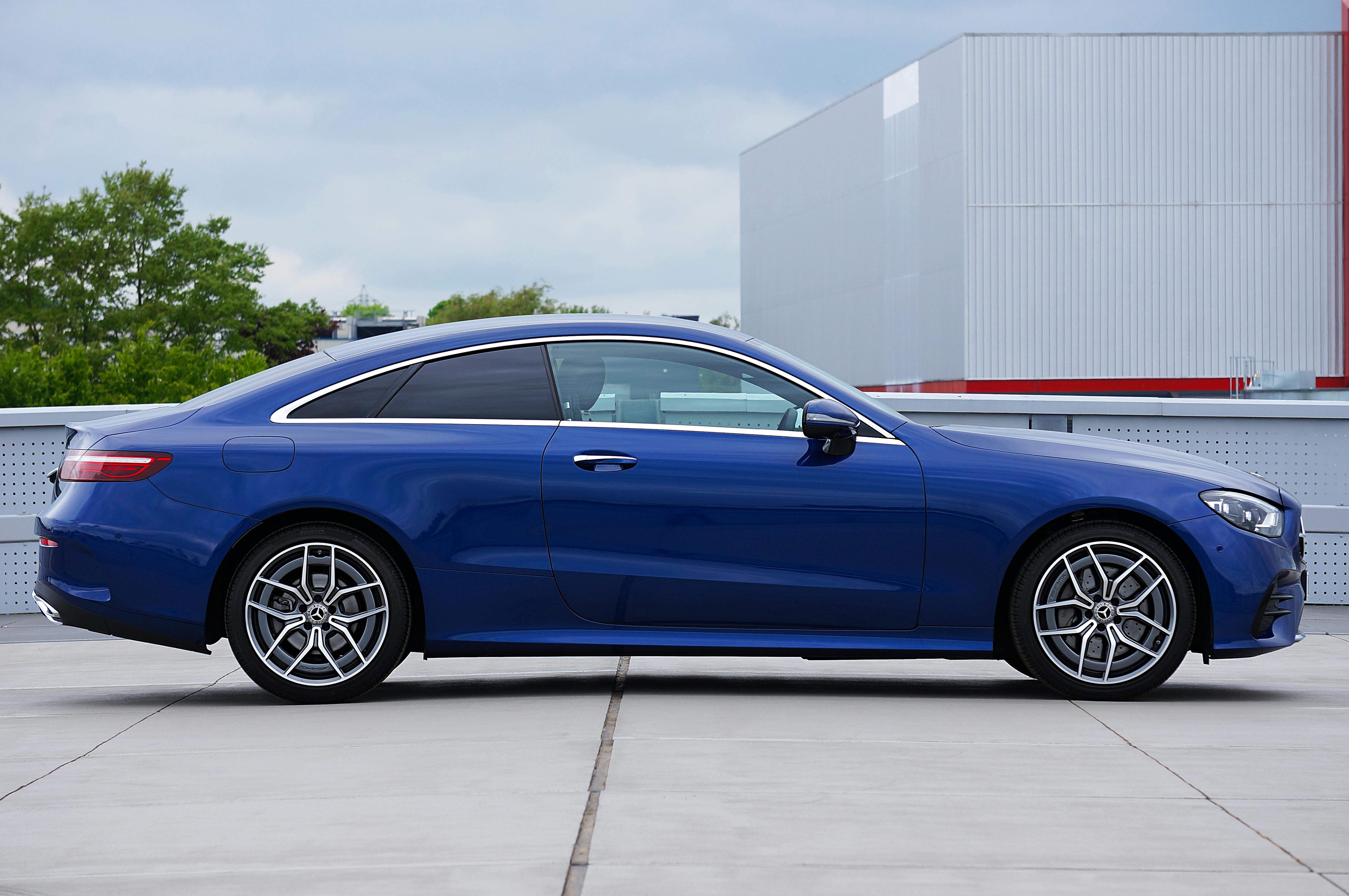 Blue Mercedes-Benz E-Class W213 Parked on the Top Floor of the Parking Garage