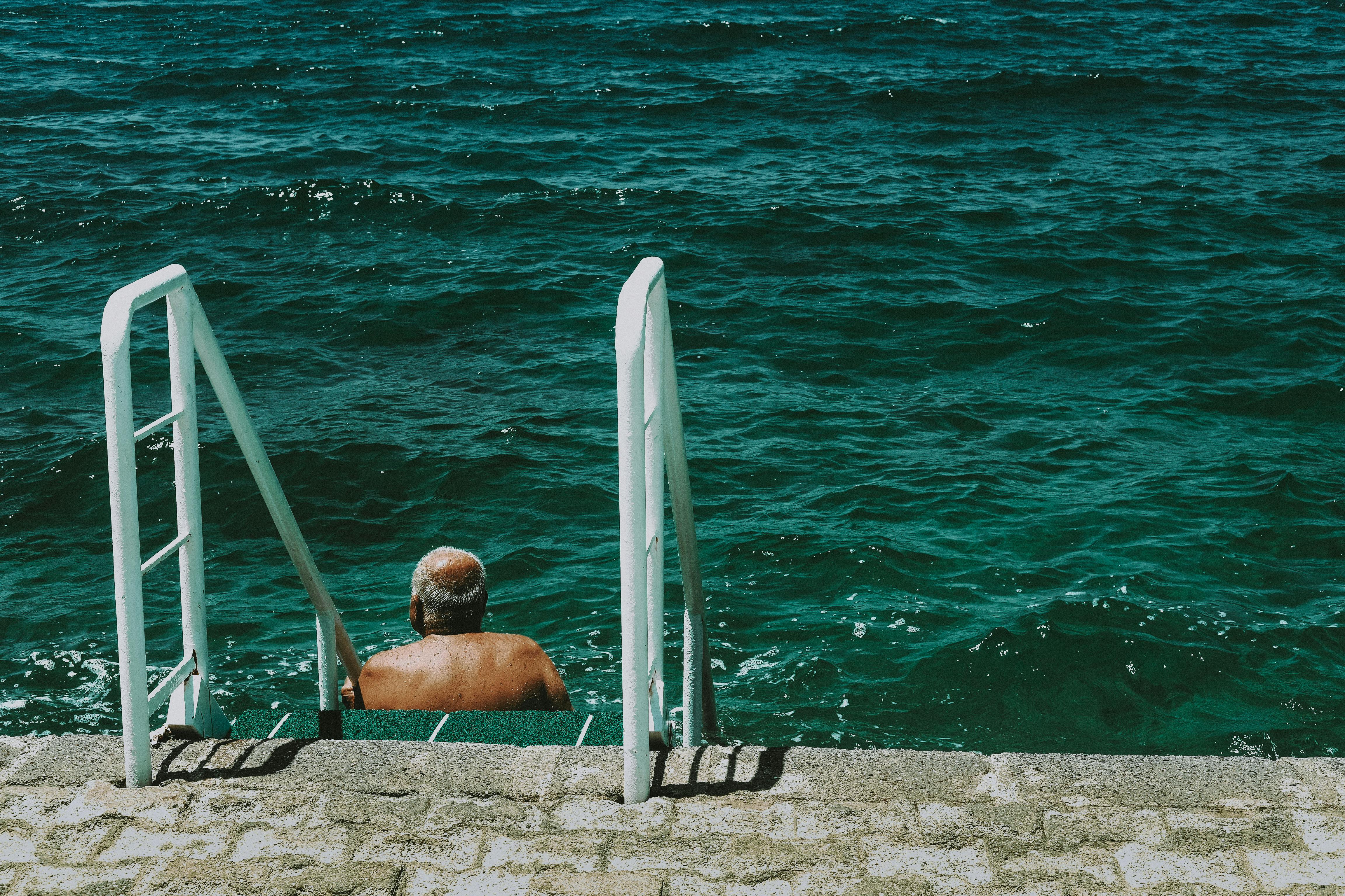 Man swimming in water