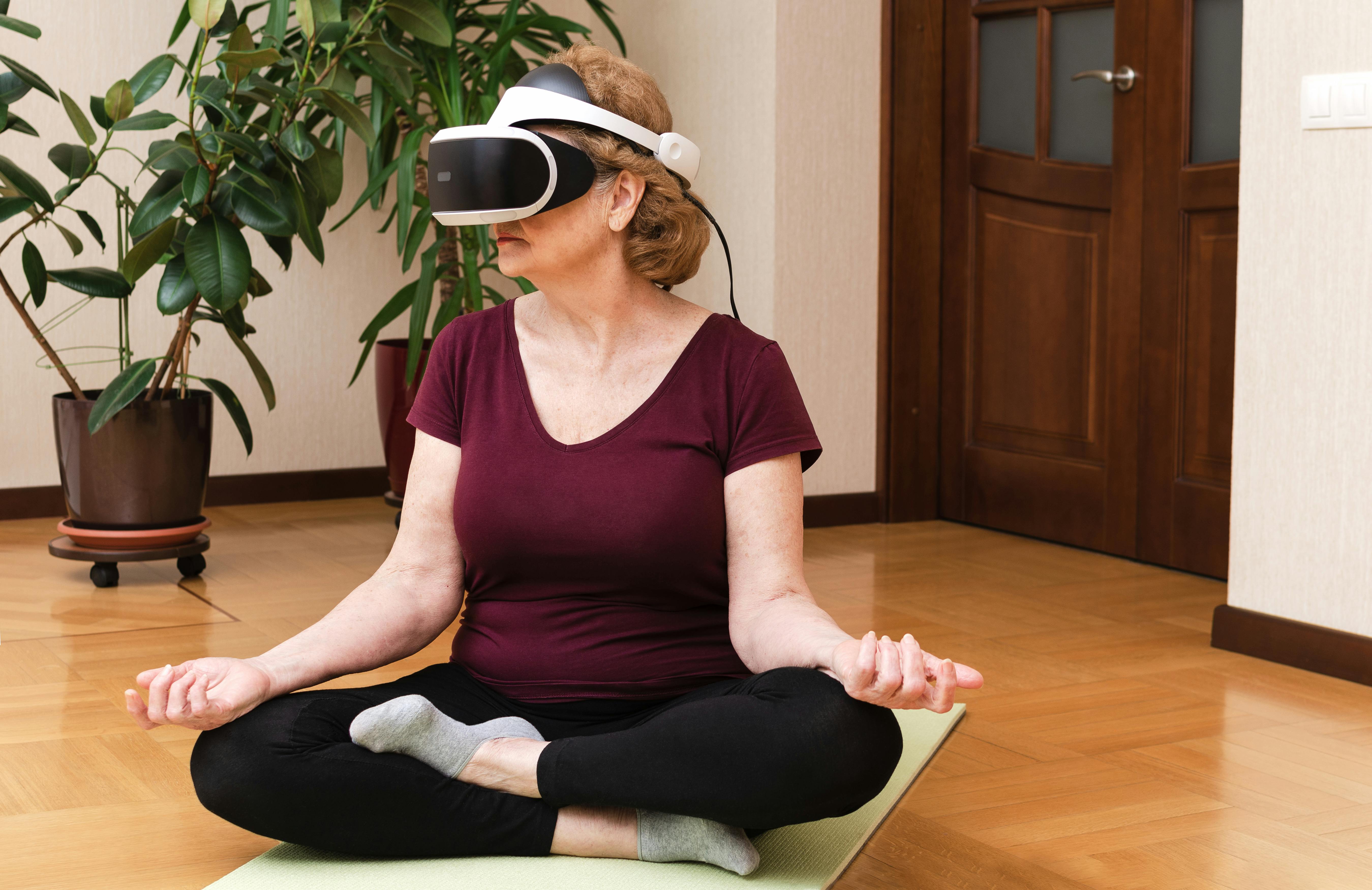 Woman Using Virtual Reality Headset while Doing Yoga