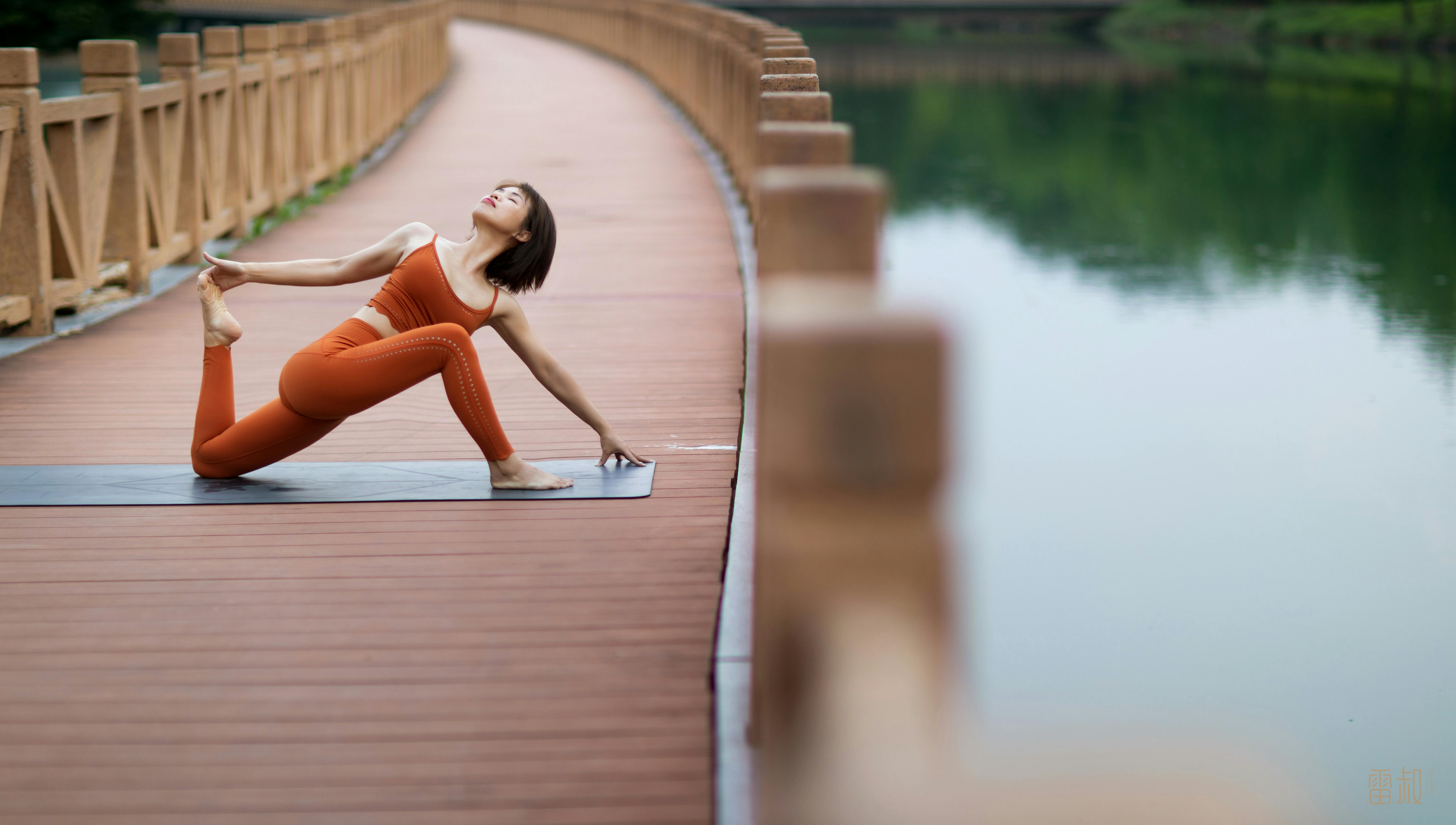 Woman Doing Yoga on a Bridge