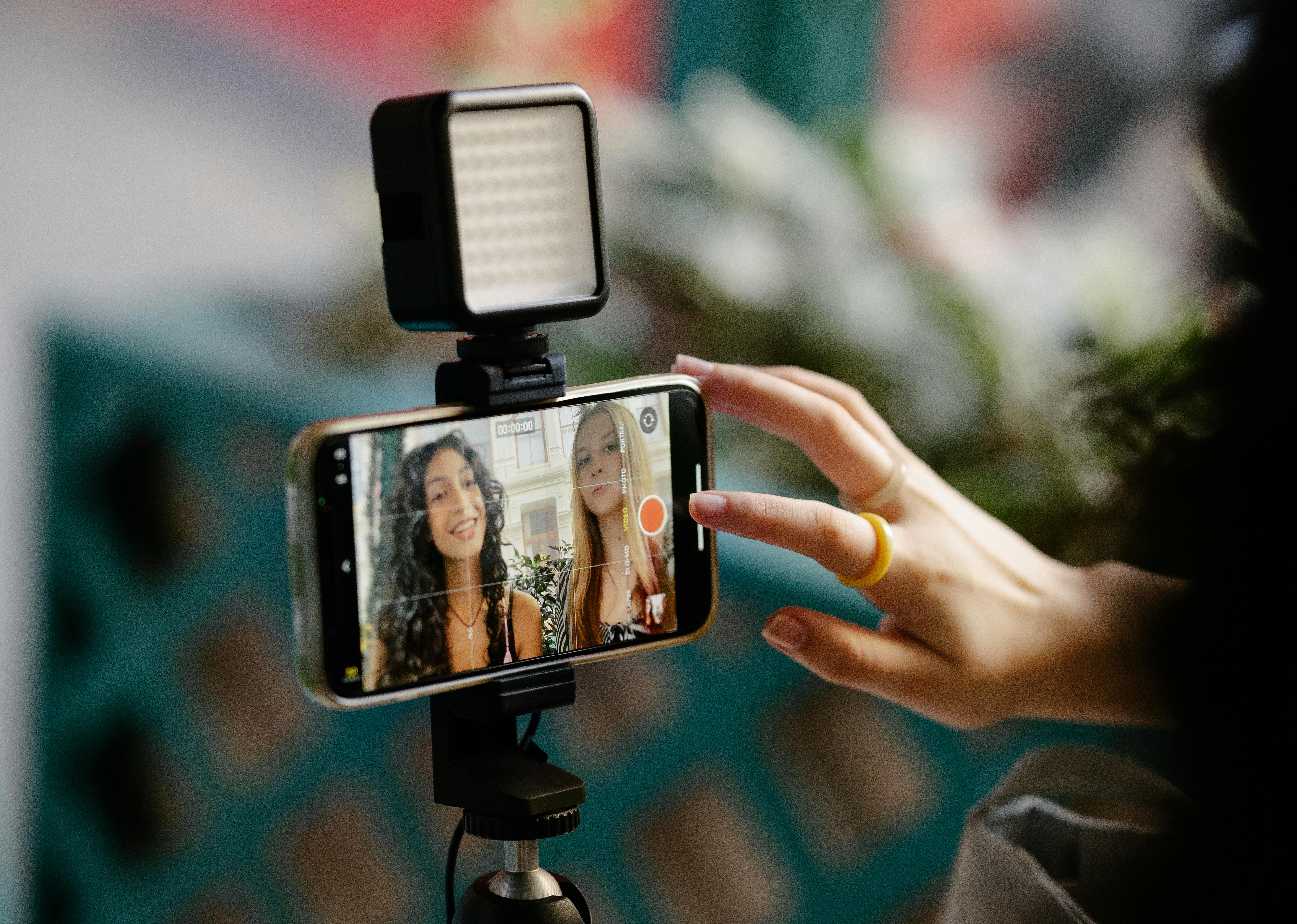 Woman Using Smartphone for Recording