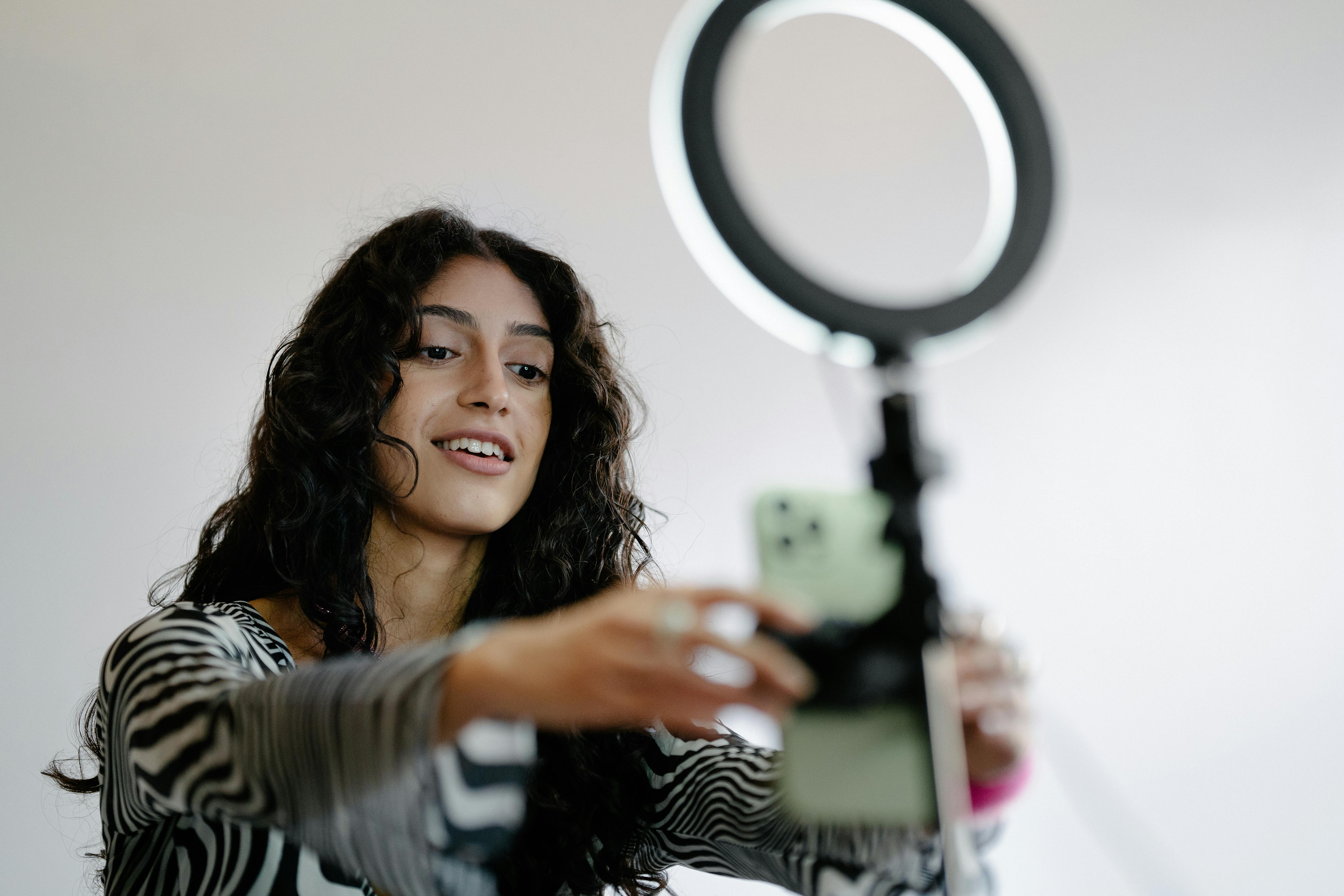 Woman Using Smartphone for Recording