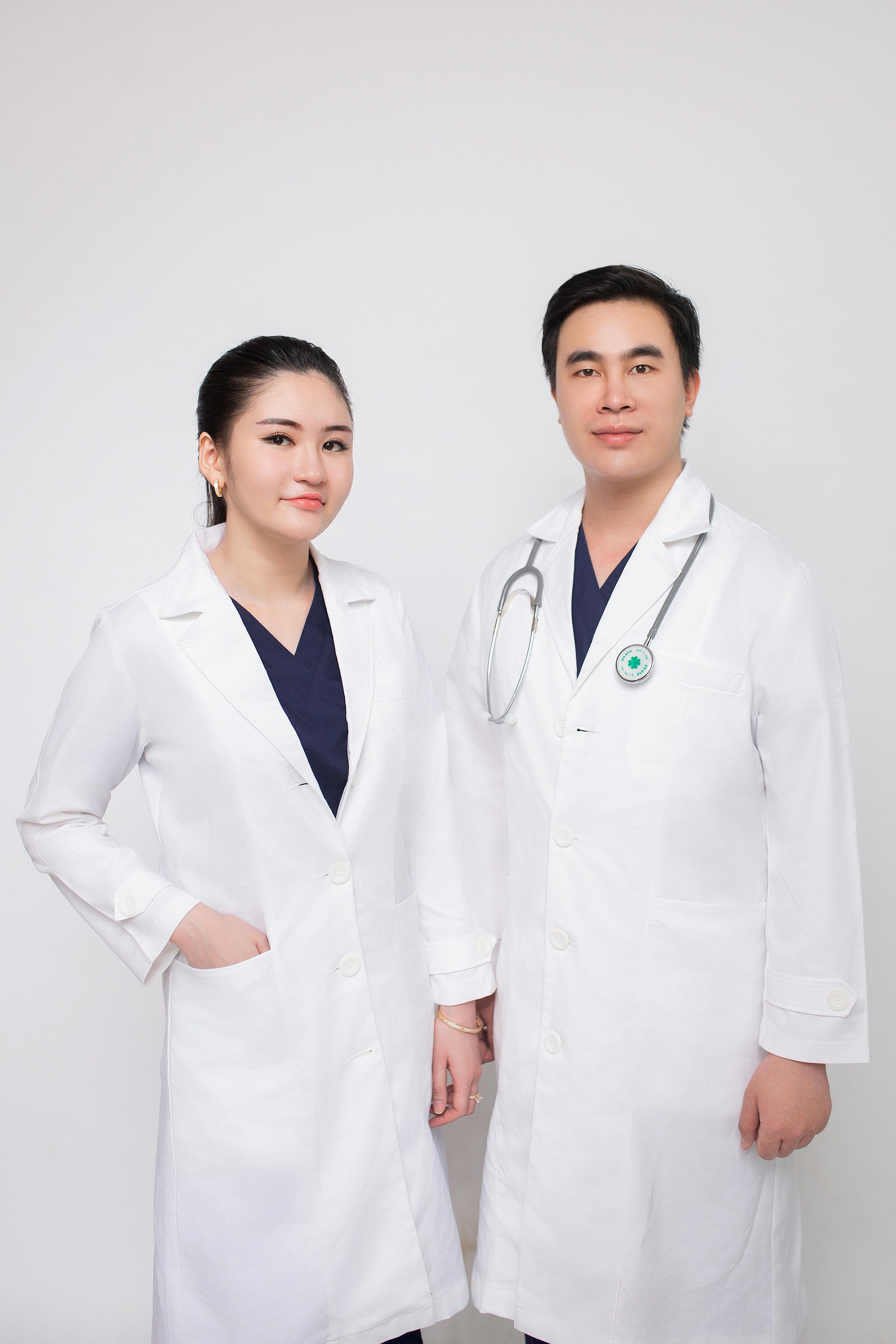 Man and Woman Doctors in Aprons 
