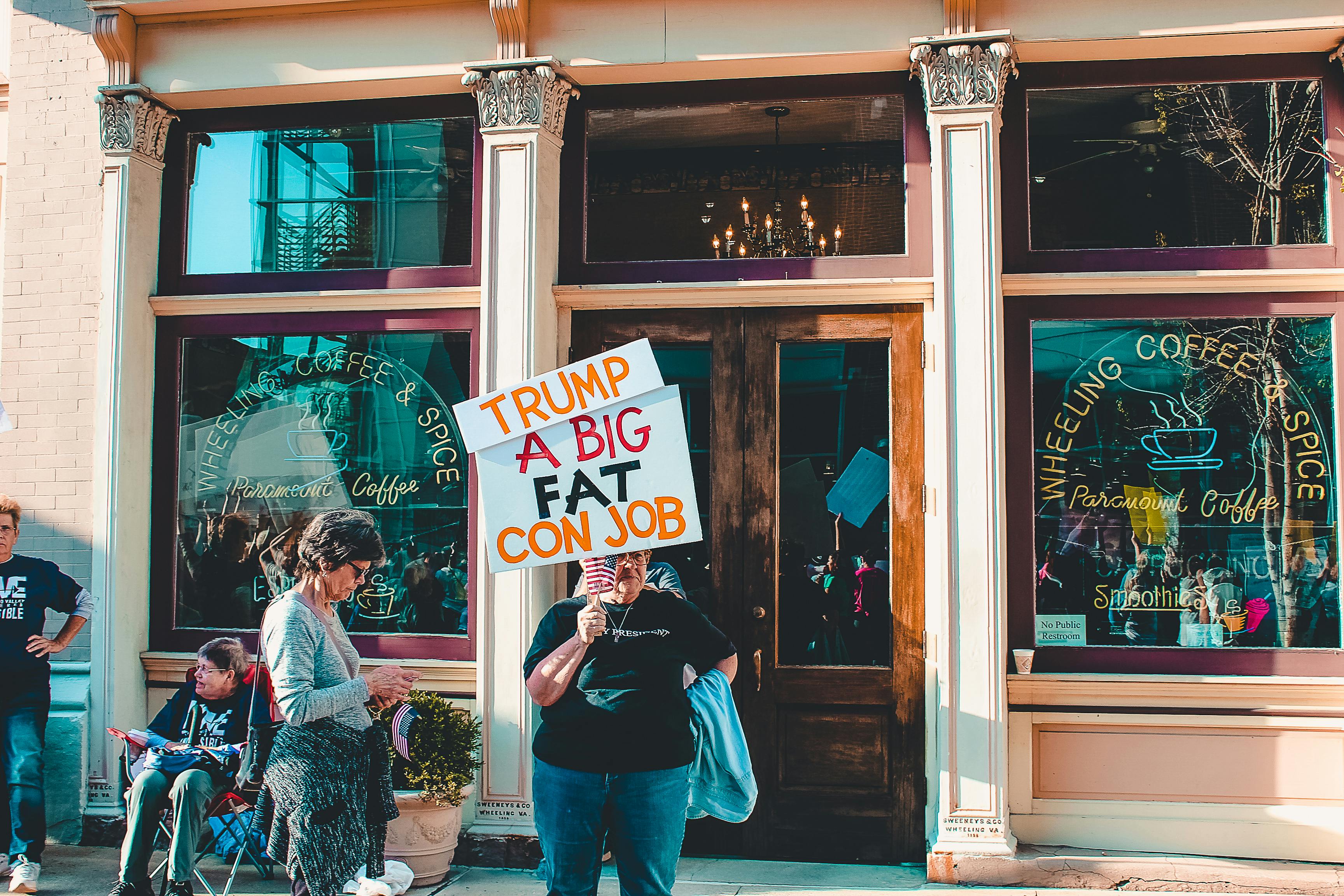 Person Holding Placard