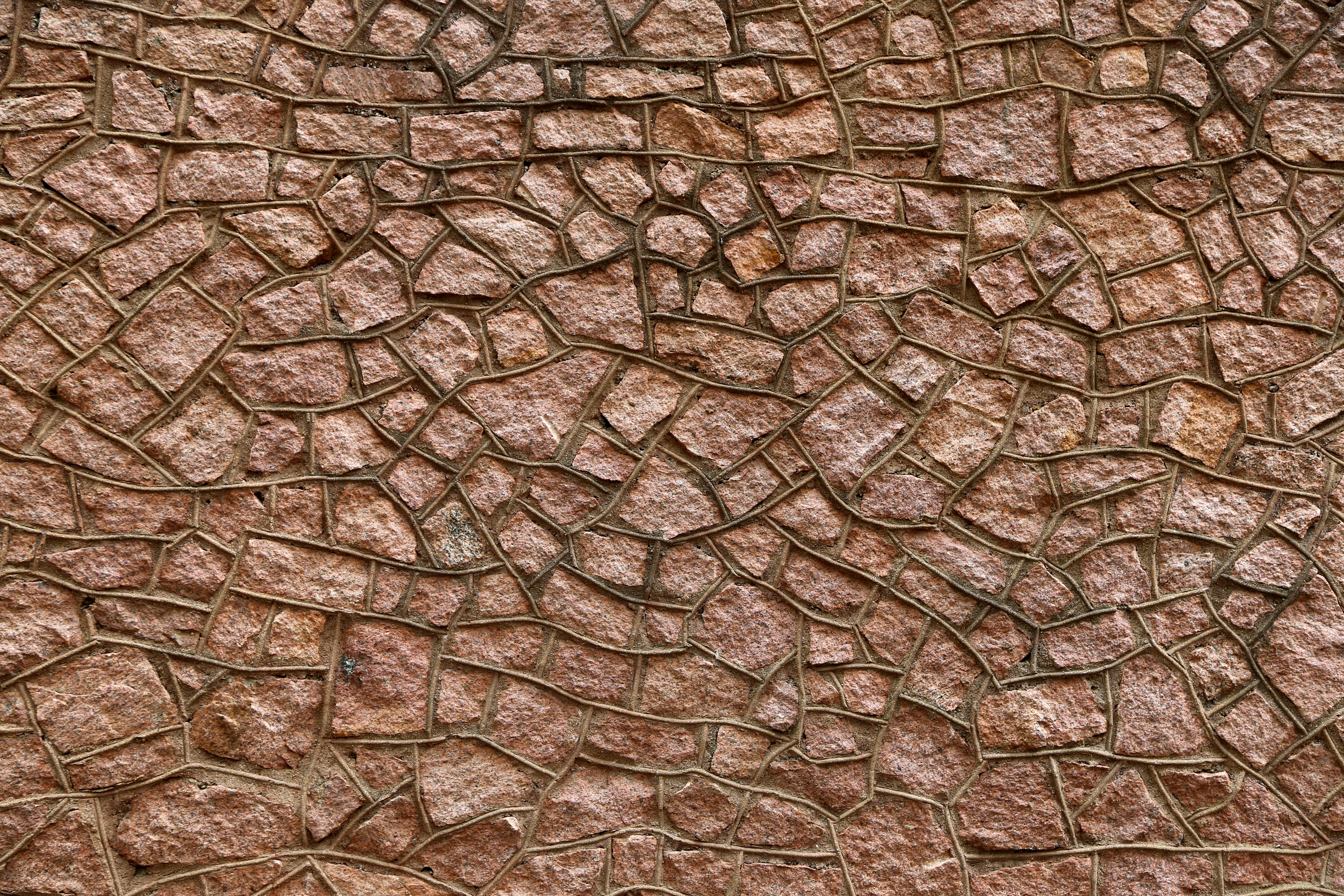 Photo of a Wall Made of Reddish Stones