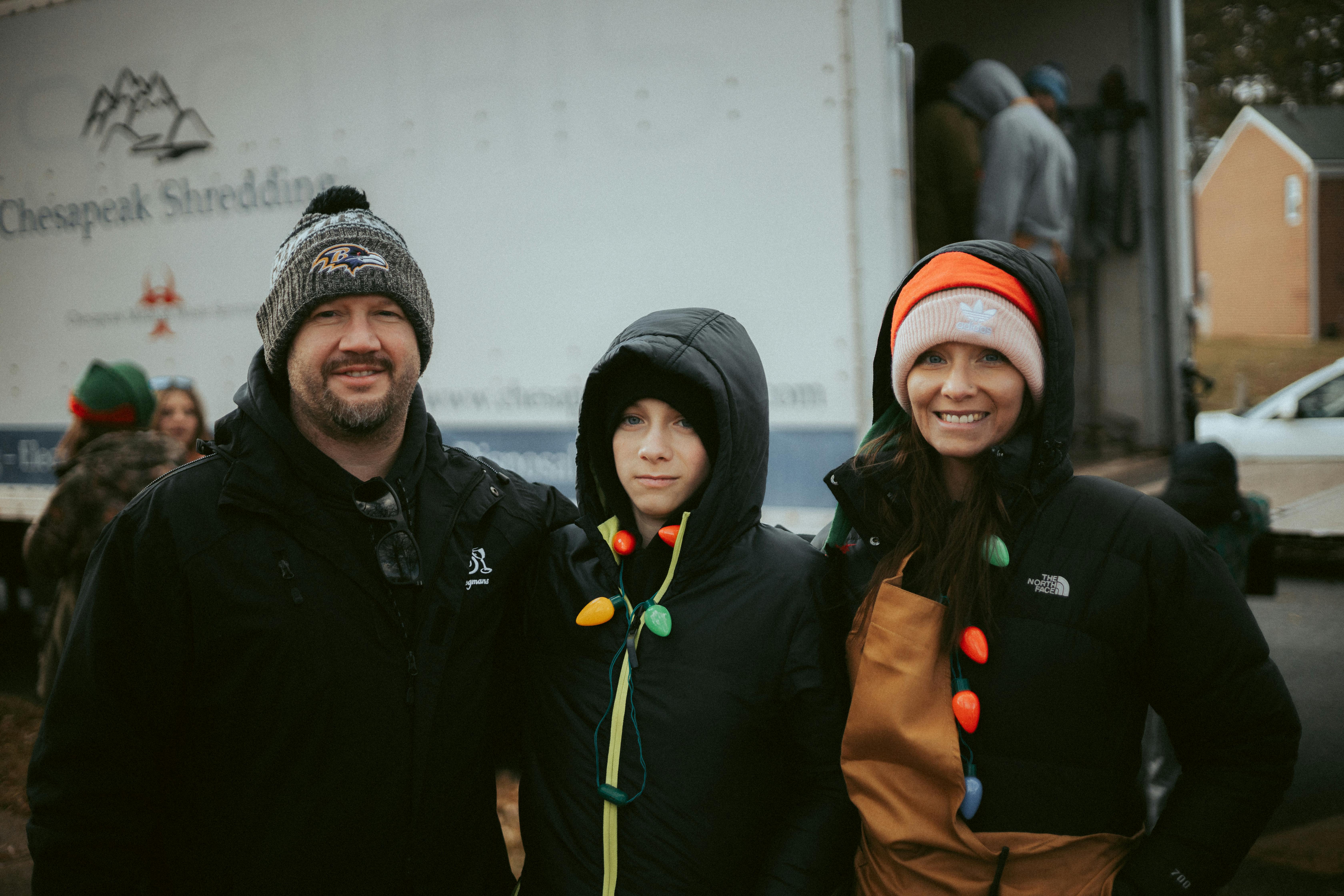 People in Christmas Costumes Volunteering in City