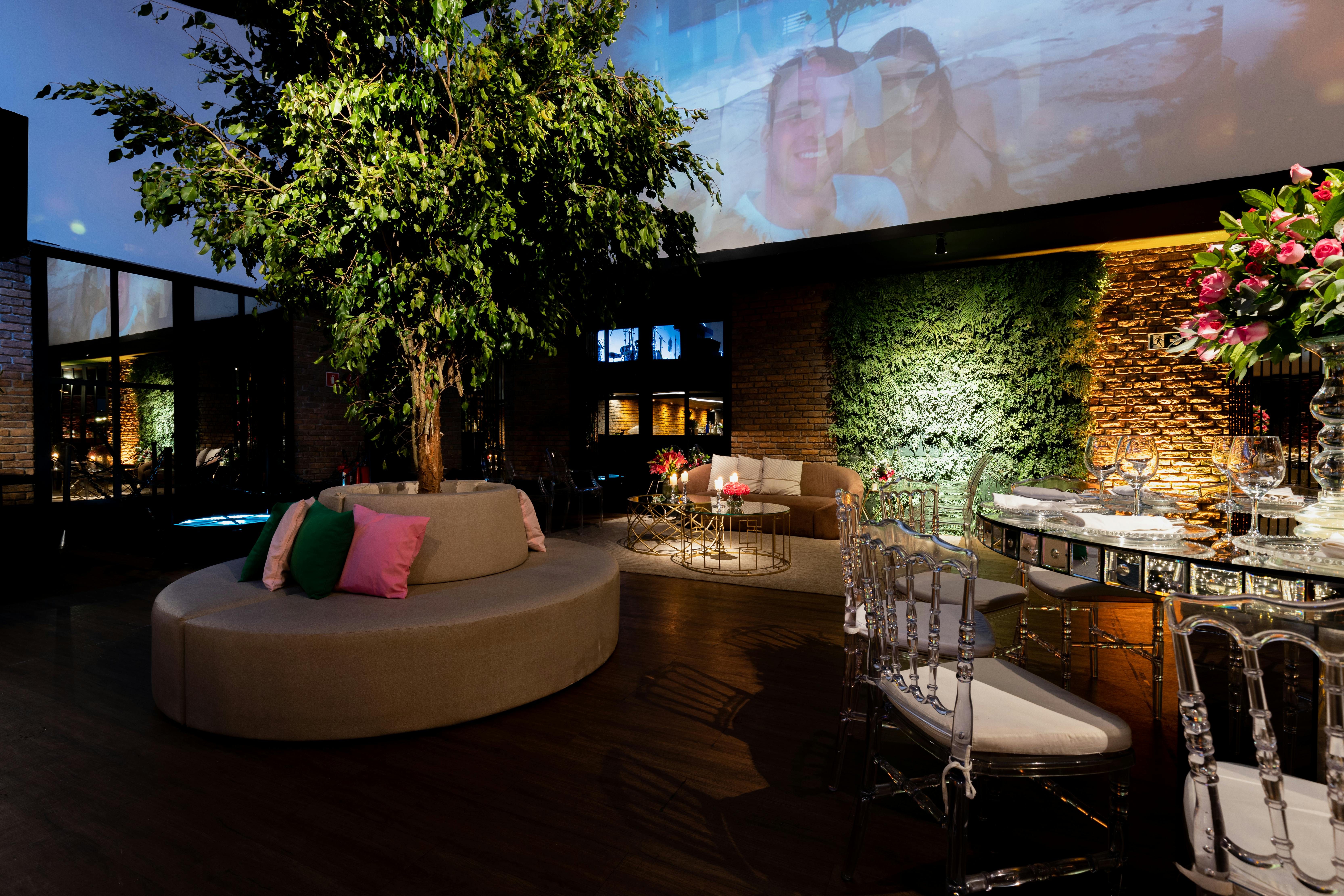 An Elegant Restaurant Interior with Sofas and Flower Decorations