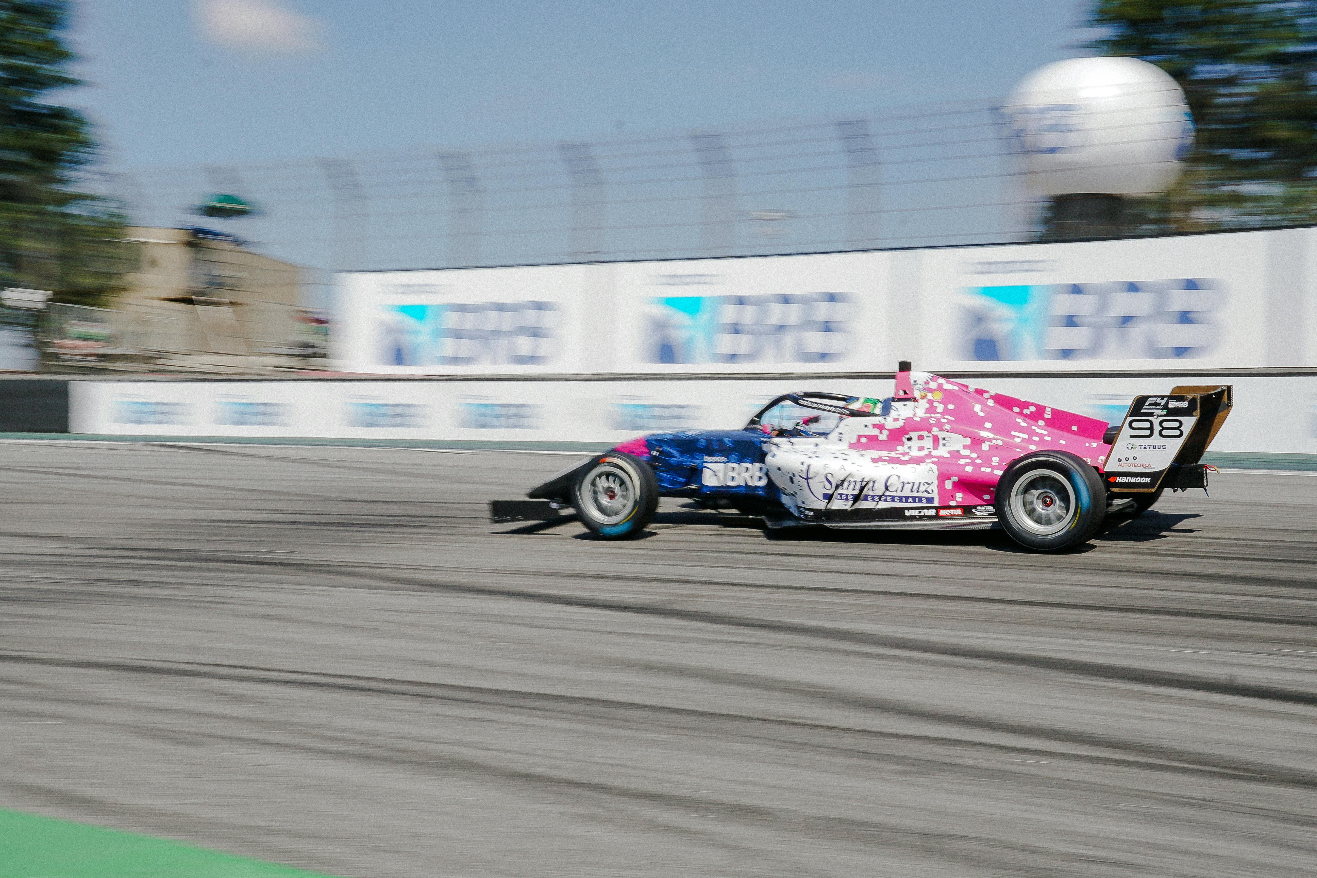 An F4 Race Car Driving on a Circuit 