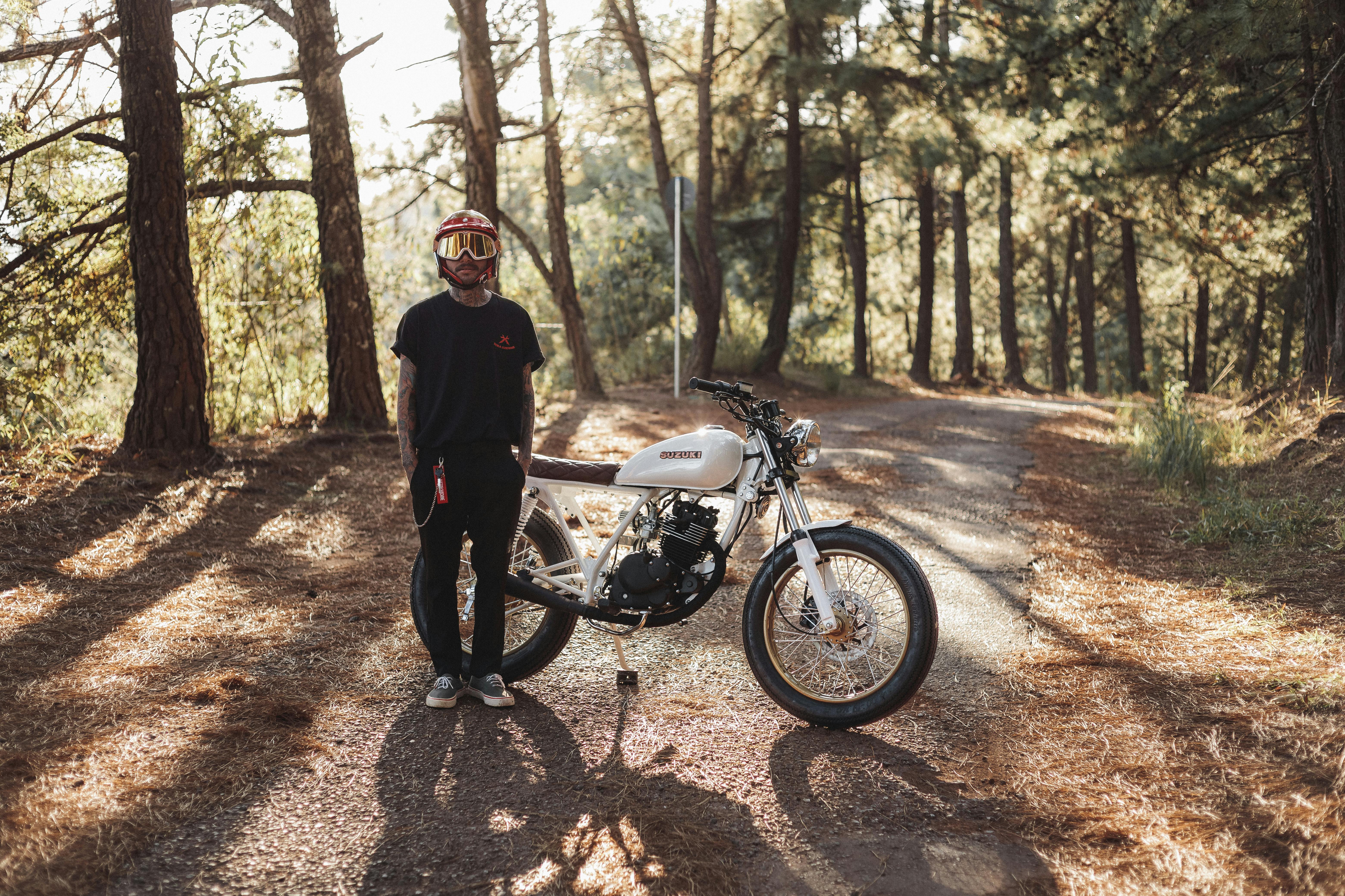 Man with Motorbike in Forest