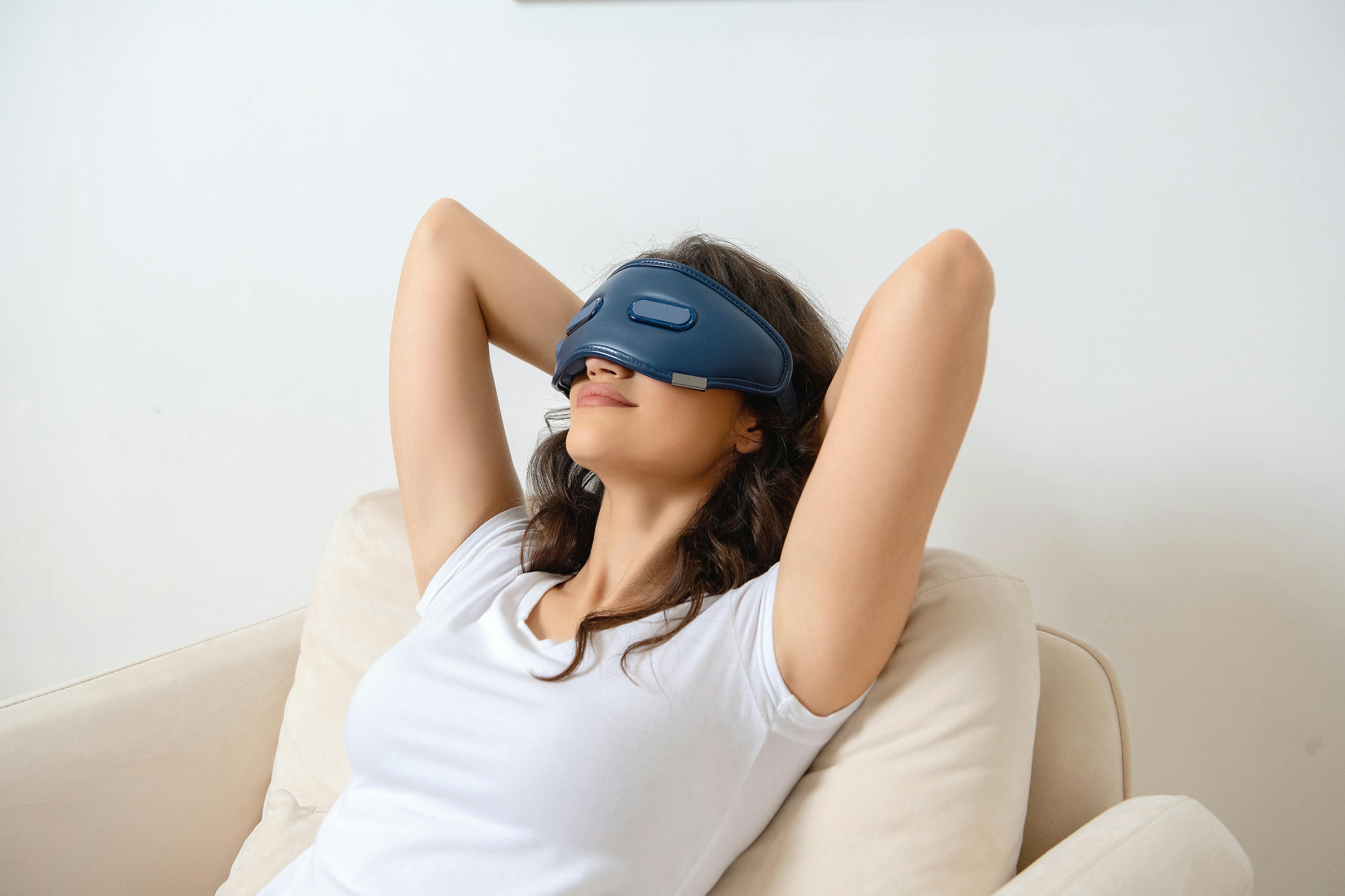 Woman Sitting with VR Goggles