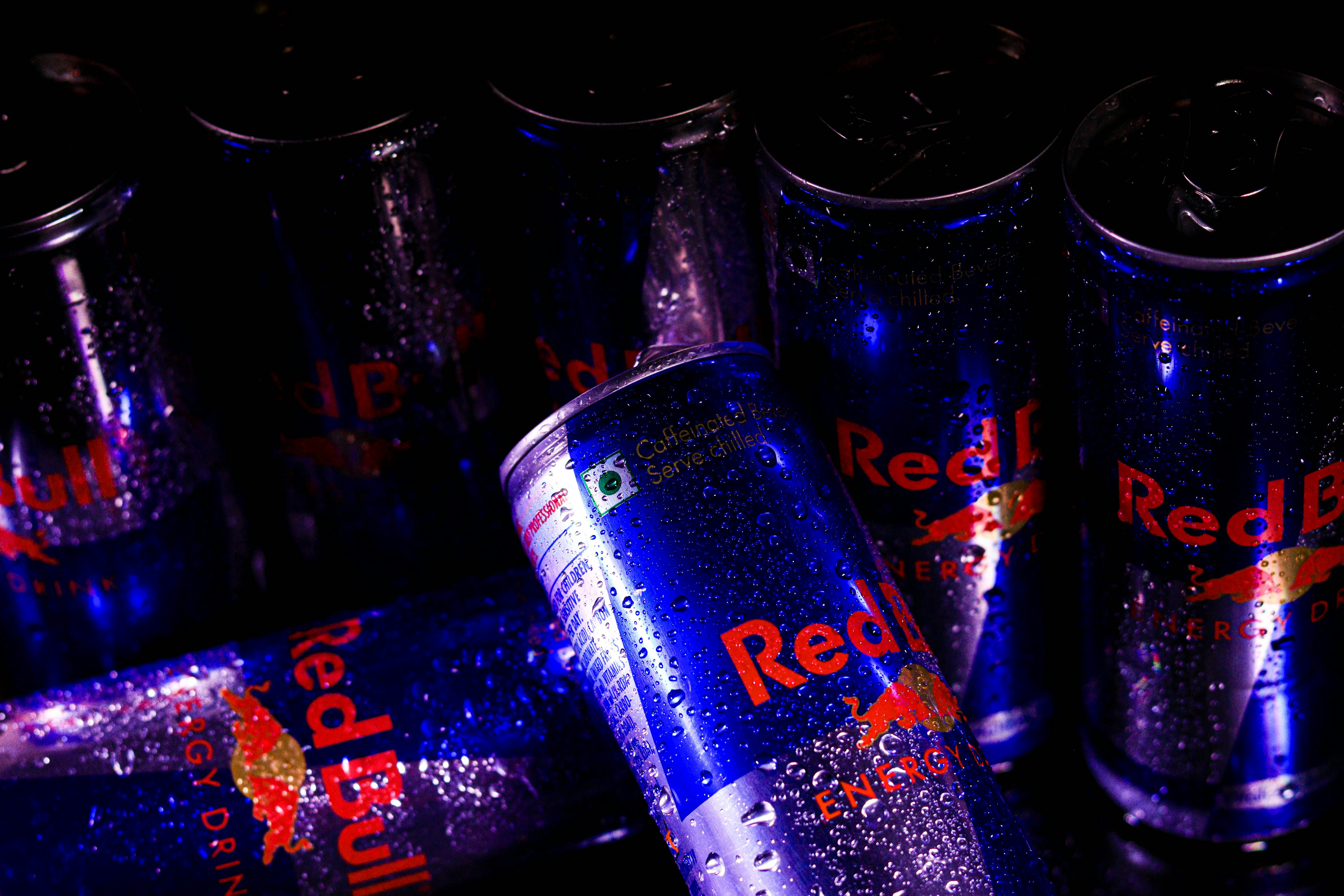 Cans of Red Bull Covered in Water Droplets