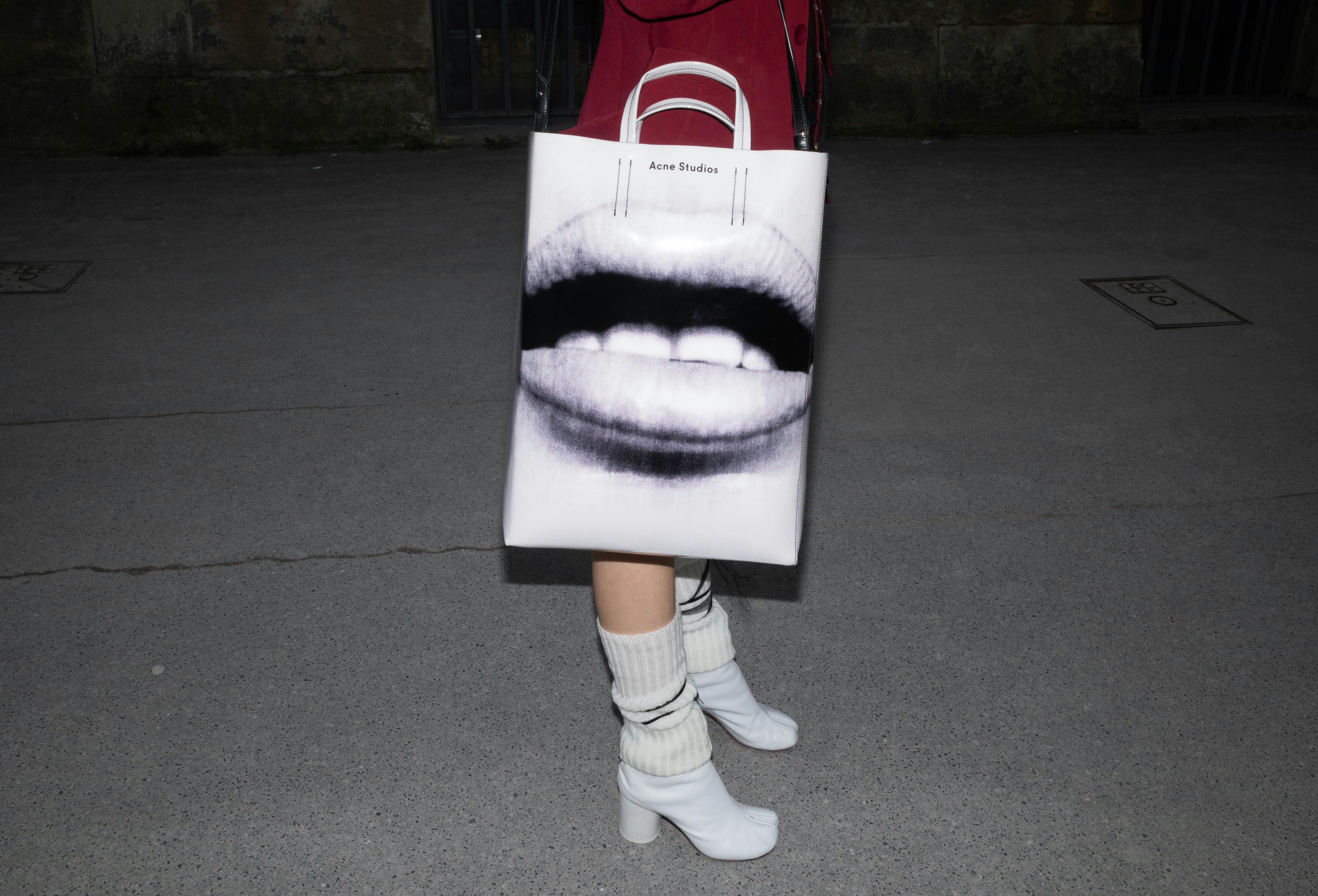 Close up of Woman in High Heels Standing with Bag